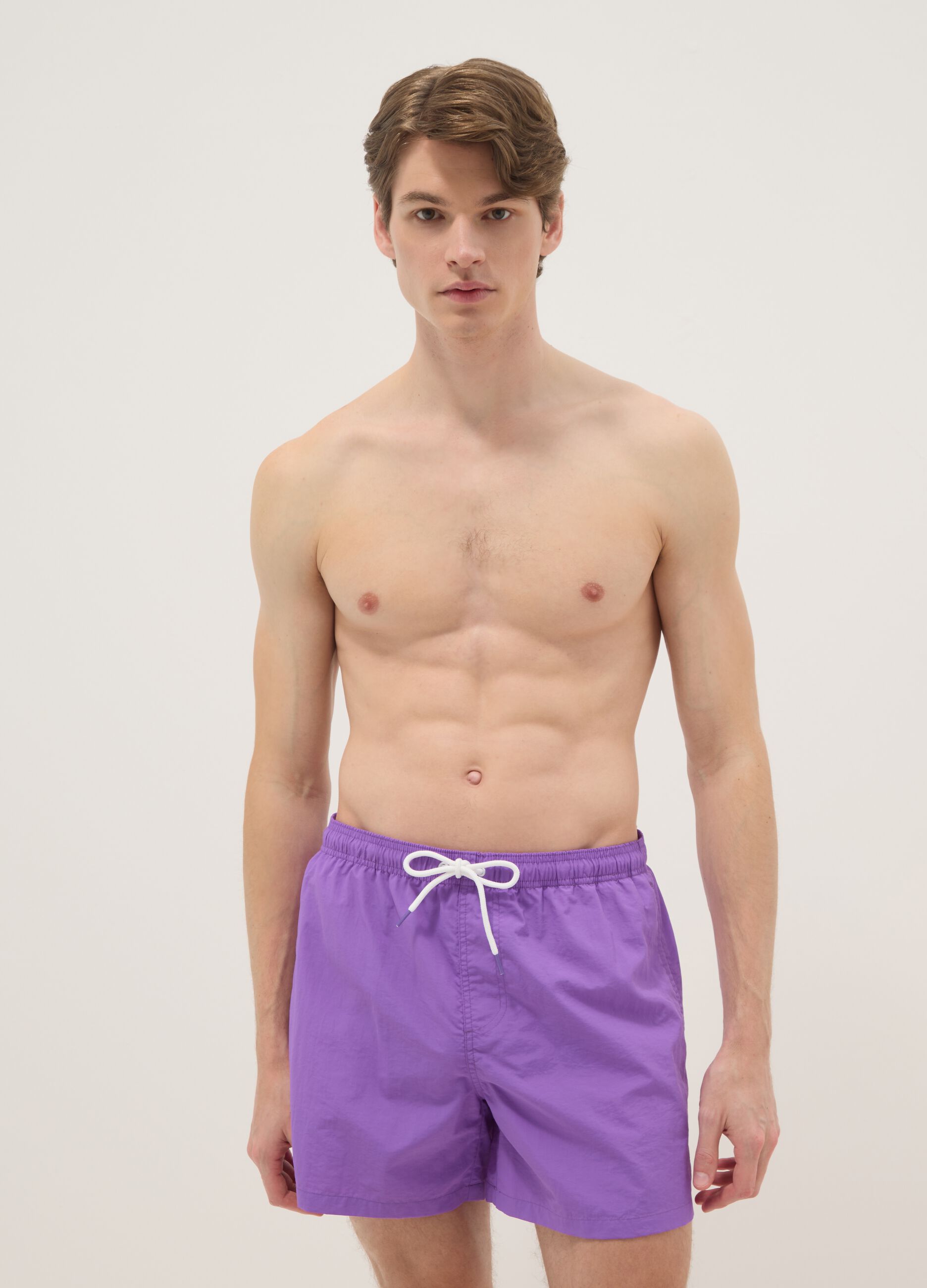 Purple swim shorts with elasticated waistband