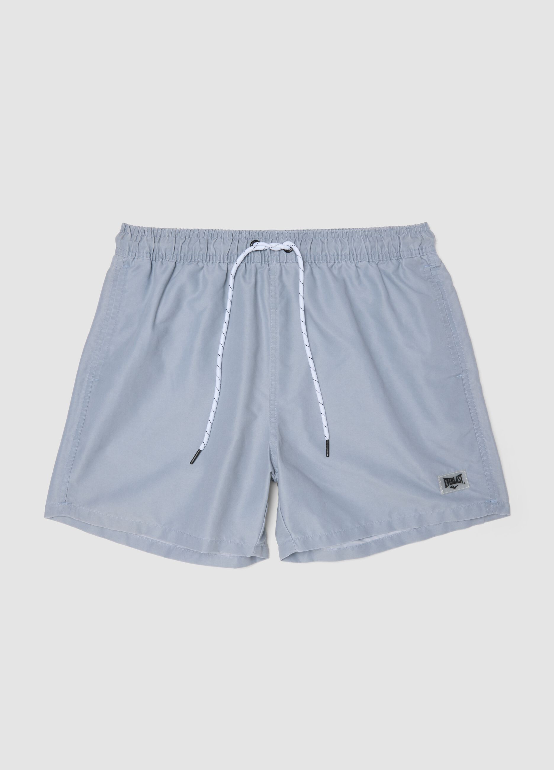 Blue swim shorts with drawstring waist