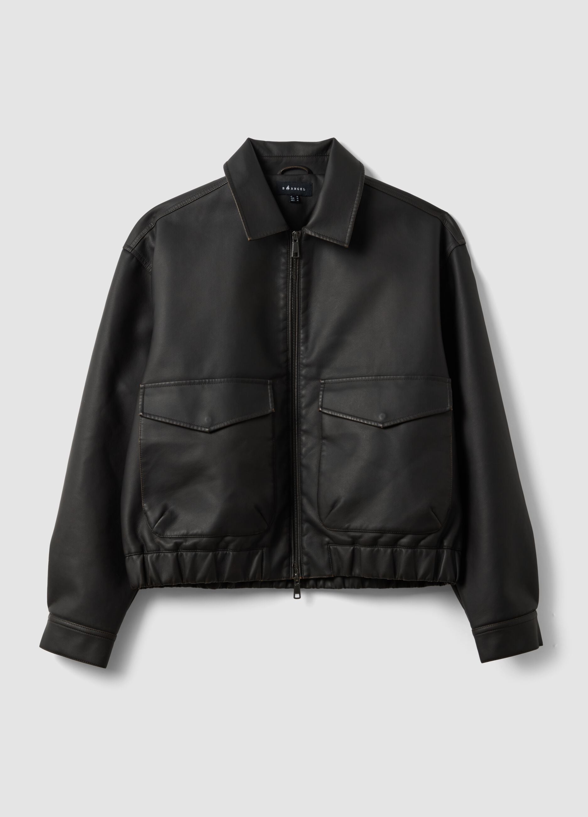 Black cropped jacket with zip and flap pockets, oversized fit