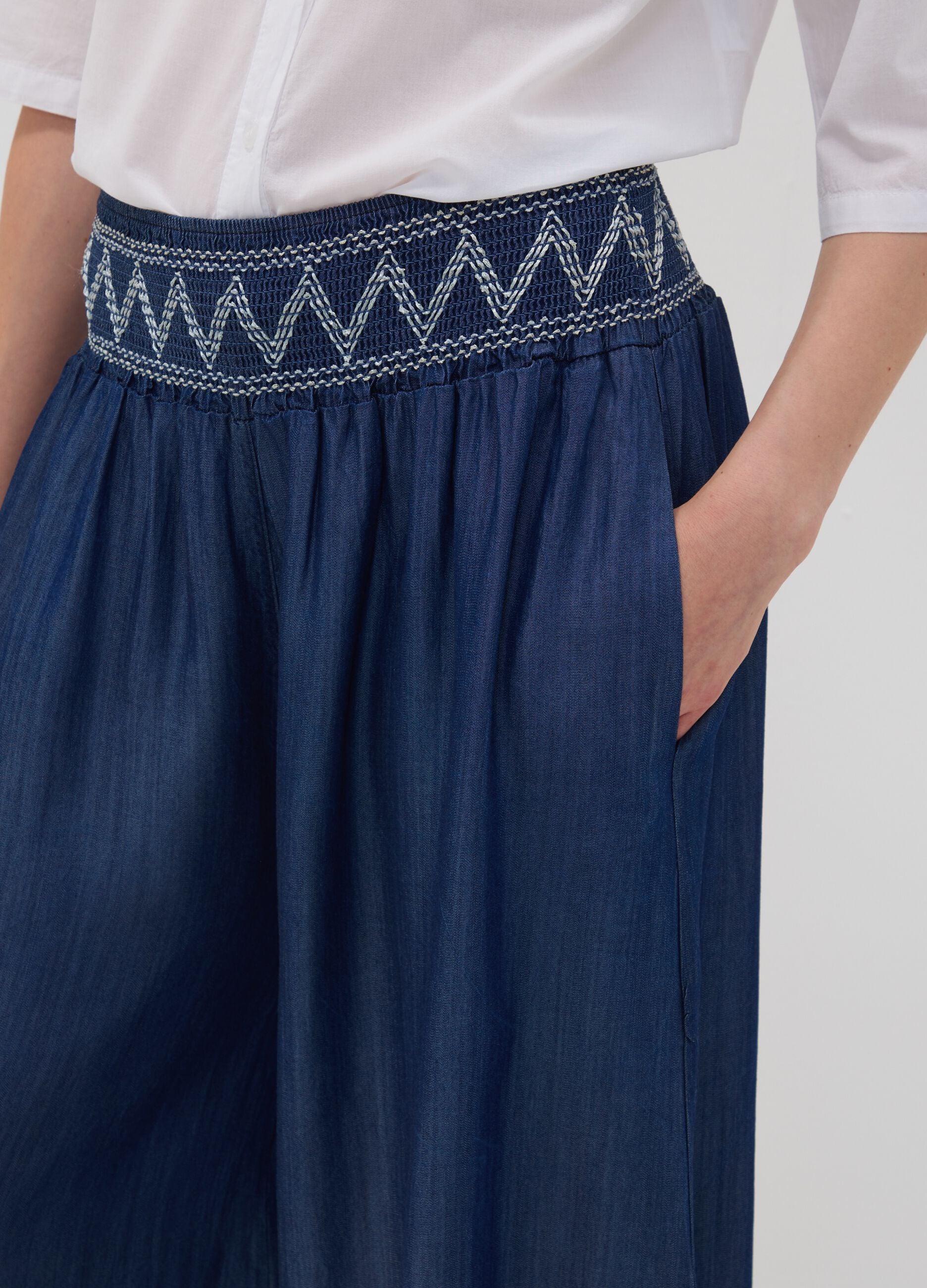 Wide-leg blue formal trousers in pure lyocell with embroidered waistband