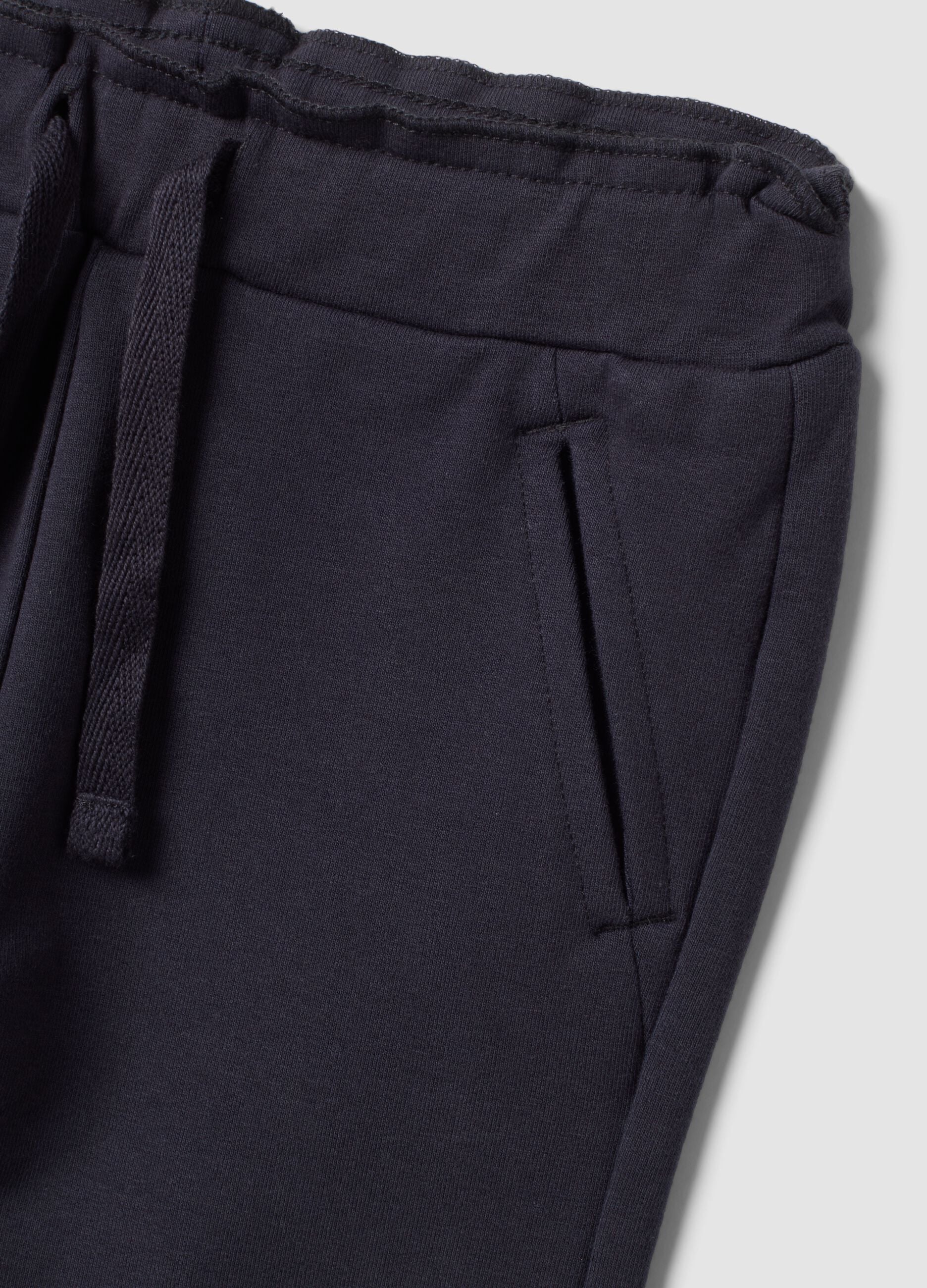 Grey stretch cotton joggers with turn-up cuffs for baby girl