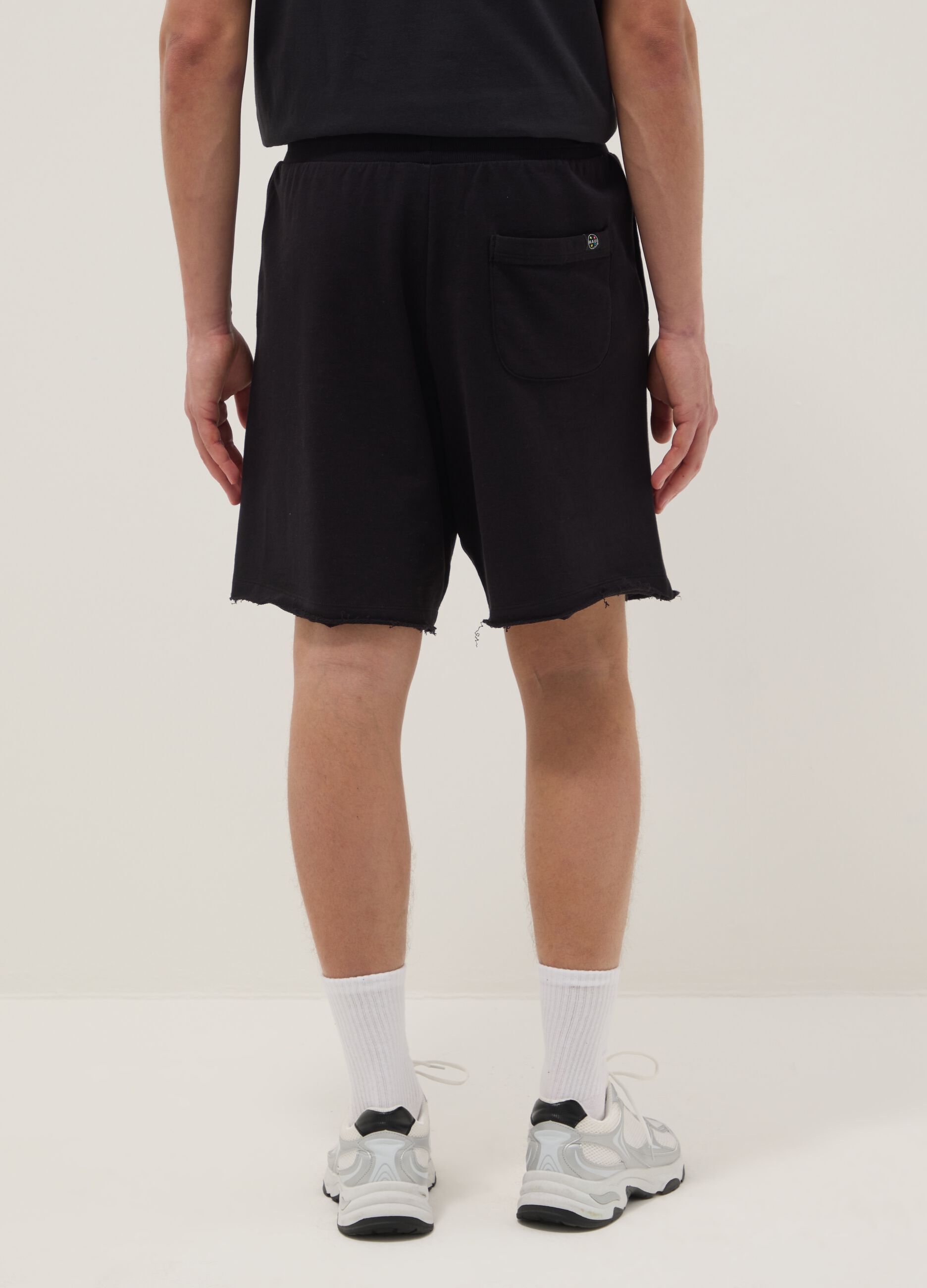Black pure cotton relaxed-fit Bermuda shorts with raw-cut hems