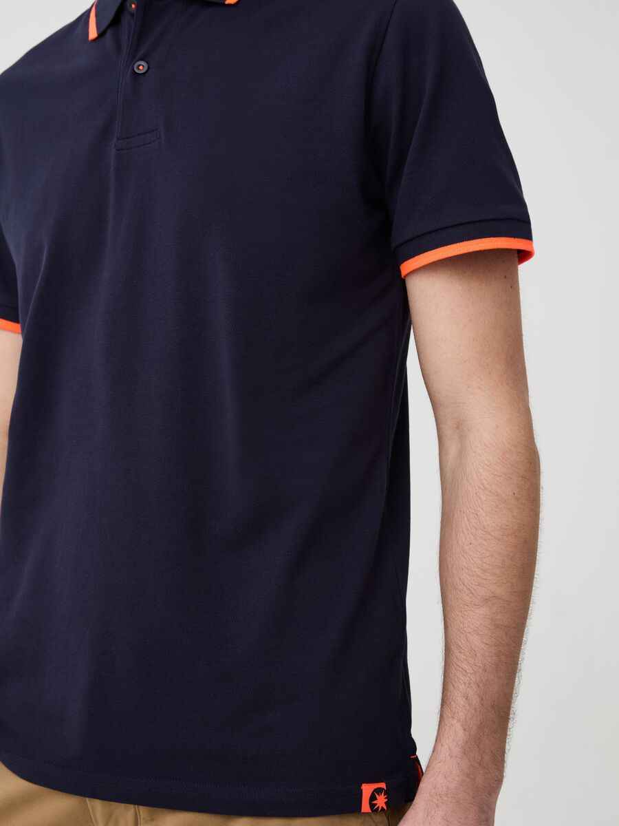 Solid colour polo shirt with fluorescent edging_1