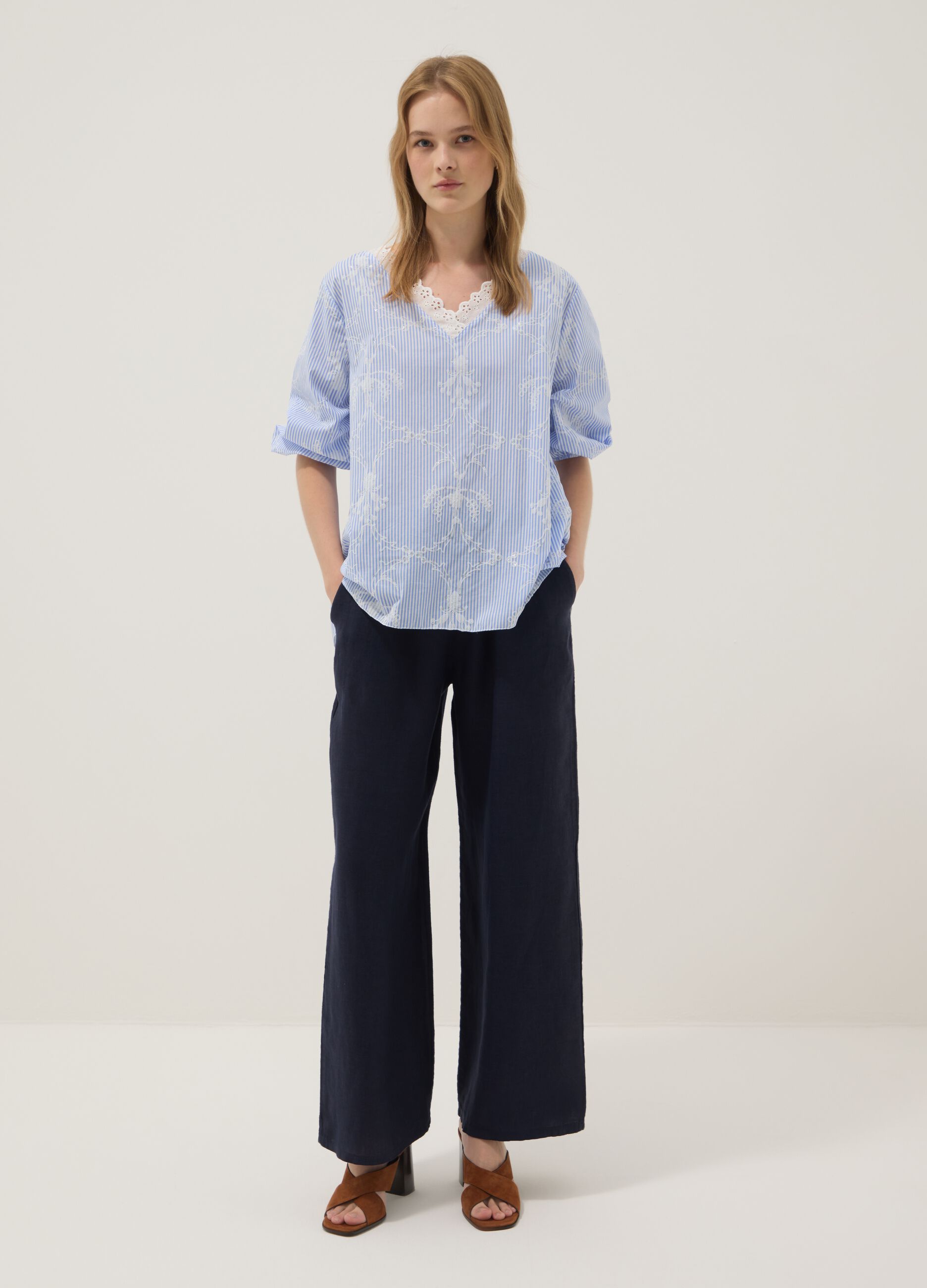 Blue cotton-blend top with embroidery and V-neck