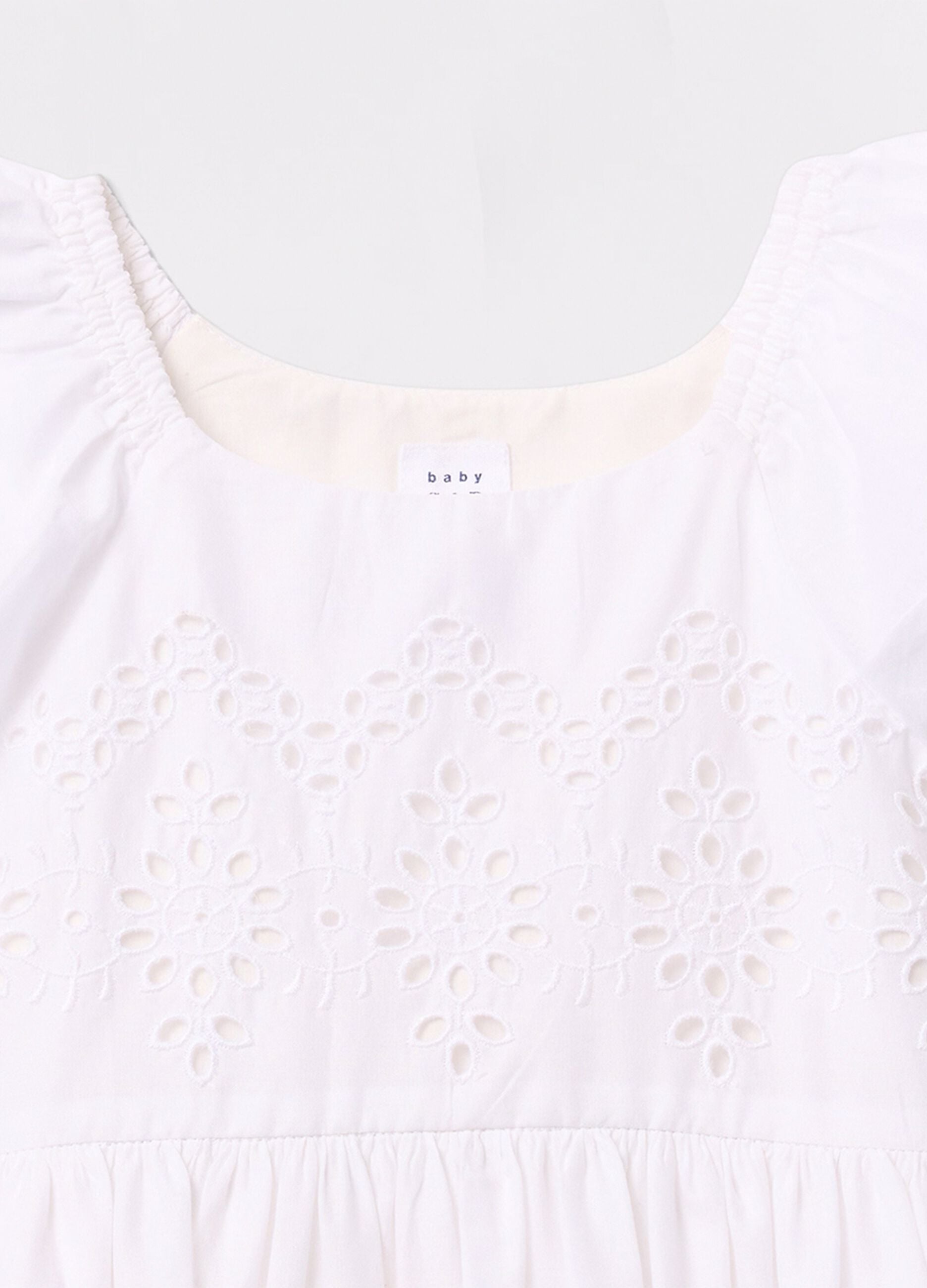 White dress in cotton with openwork flowers