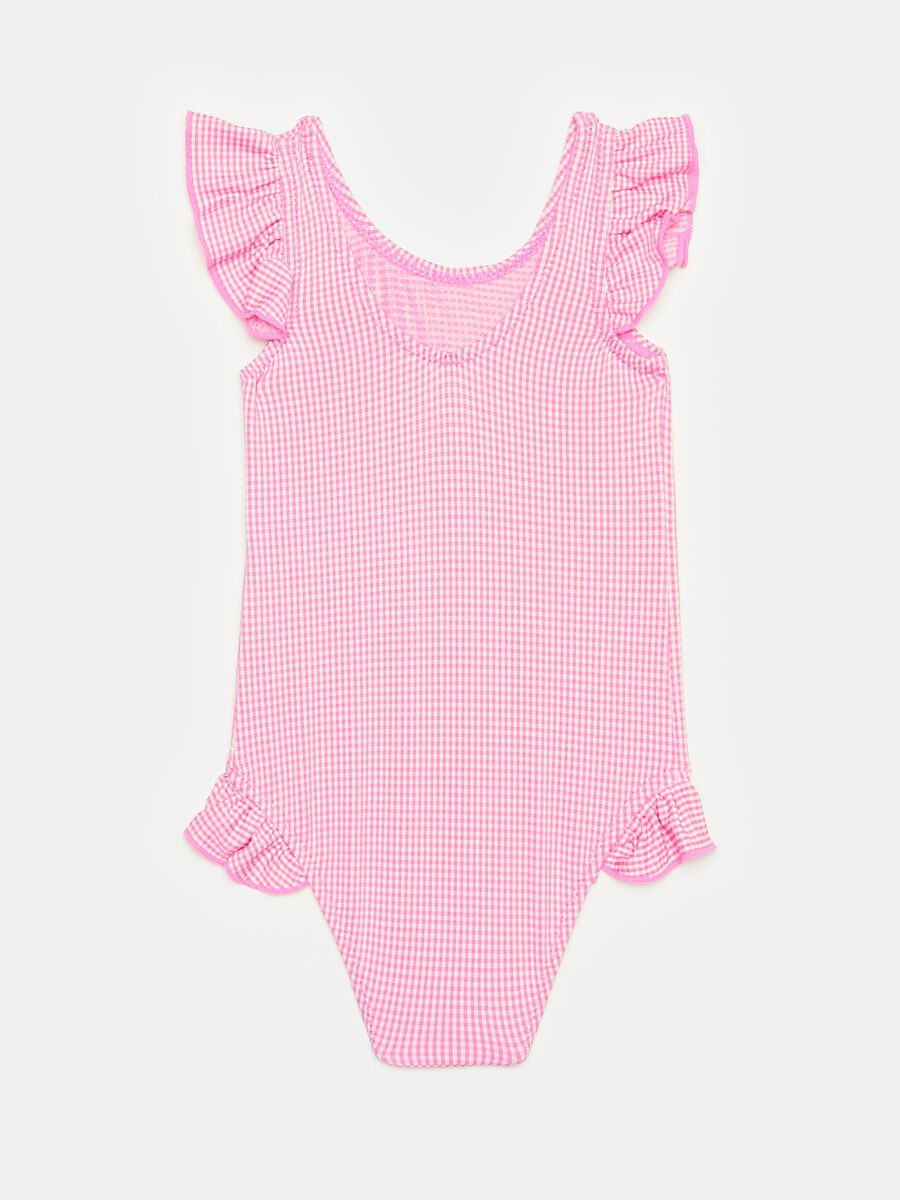 One-piece swimsuit with gingham pattern and flounce_1