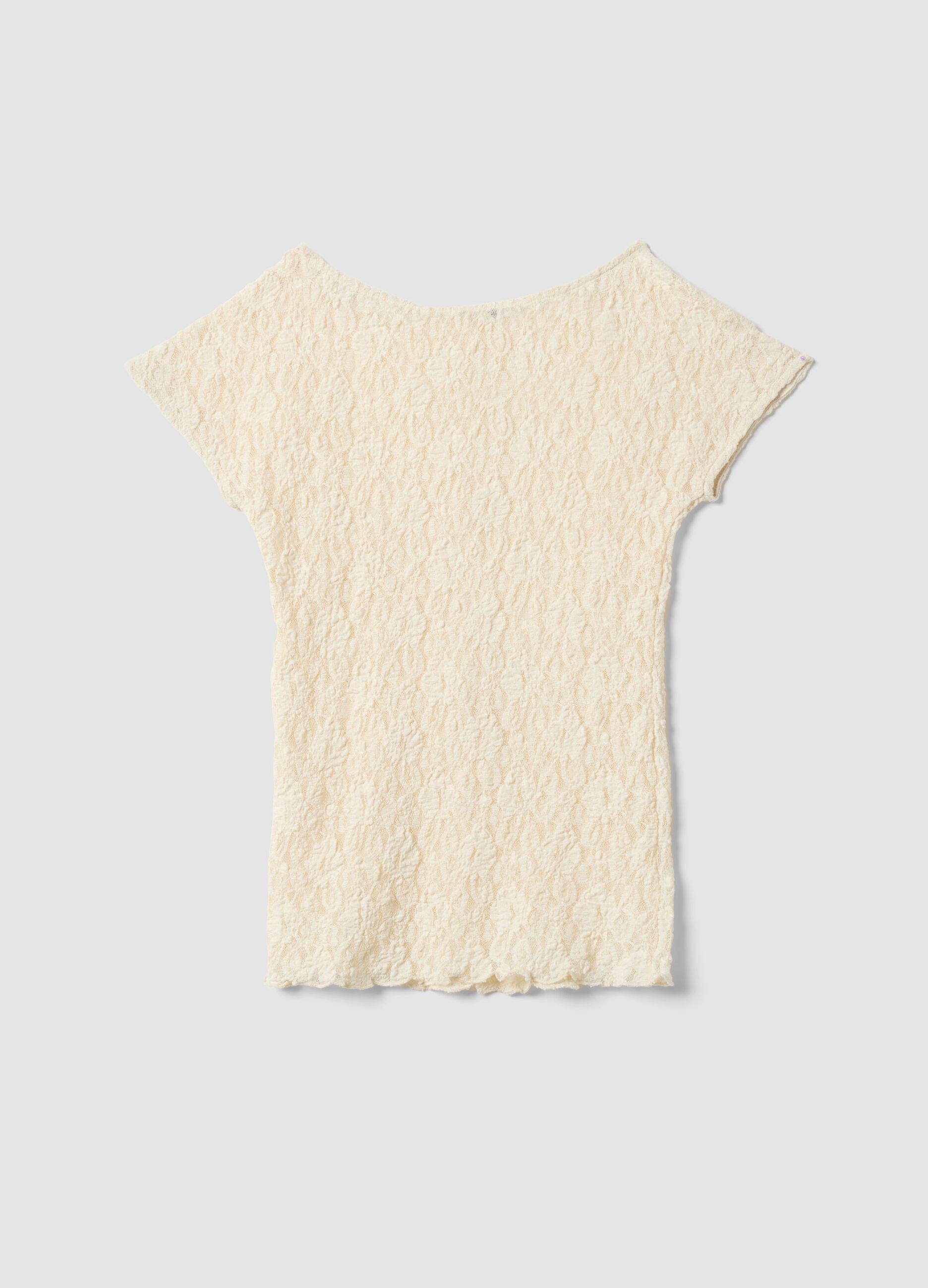 T-shirt bianca in tessuto elasticizzato con texture floreale in rilievo