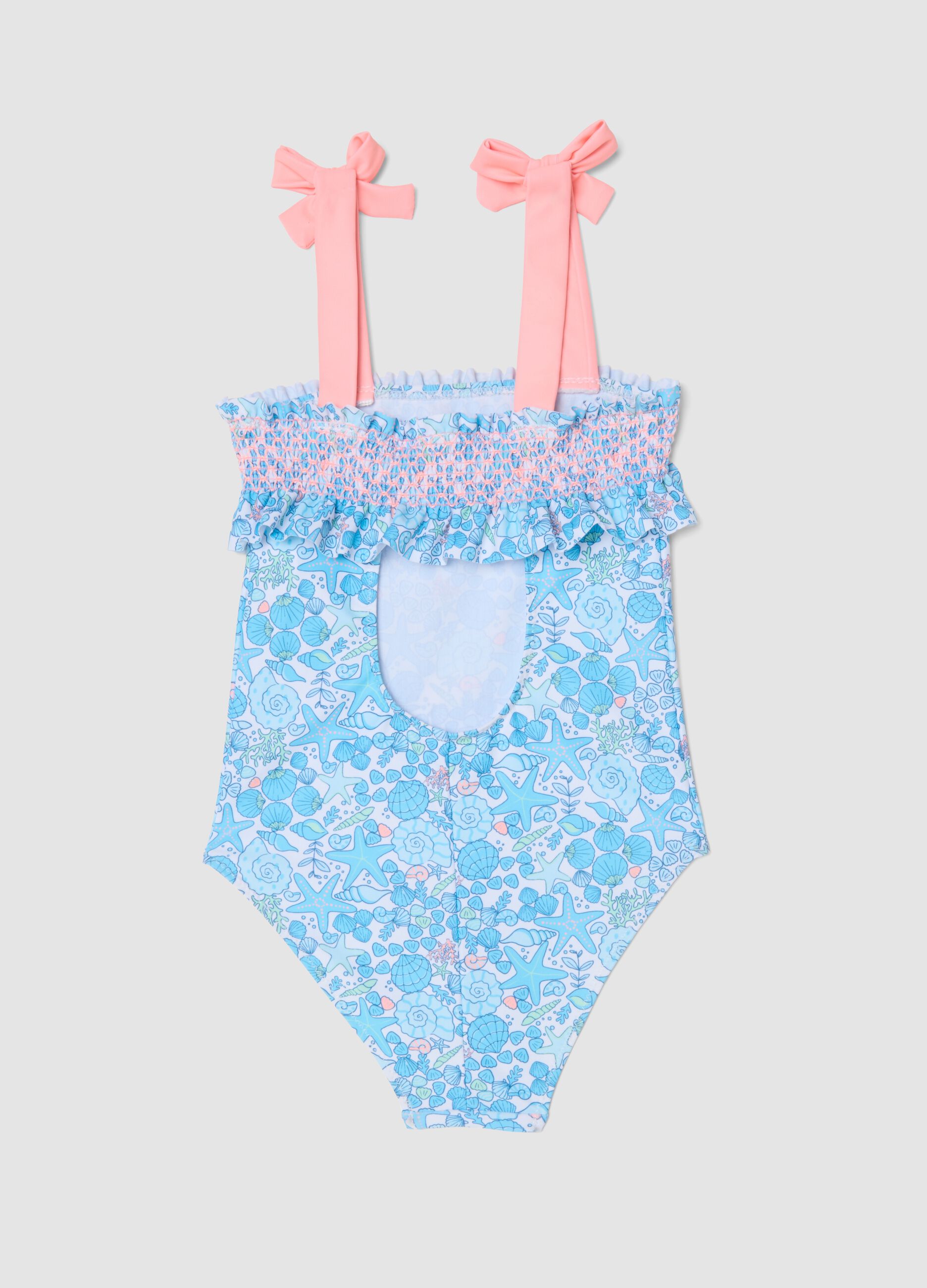 Blue stretch swimsuit with marine print for girls