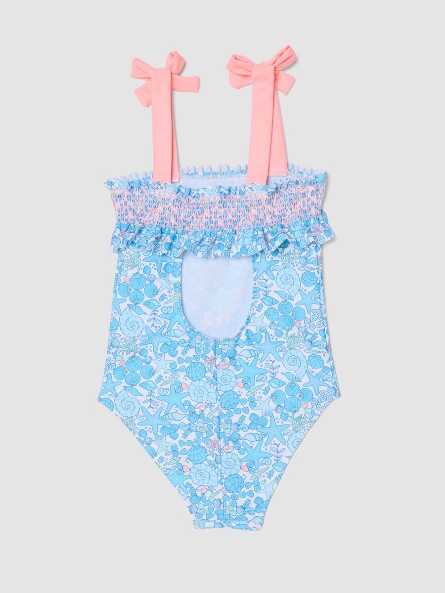 Fato de banho azul de menina, inteiro, em tecido el&aacute;stico com estampado marinho_1