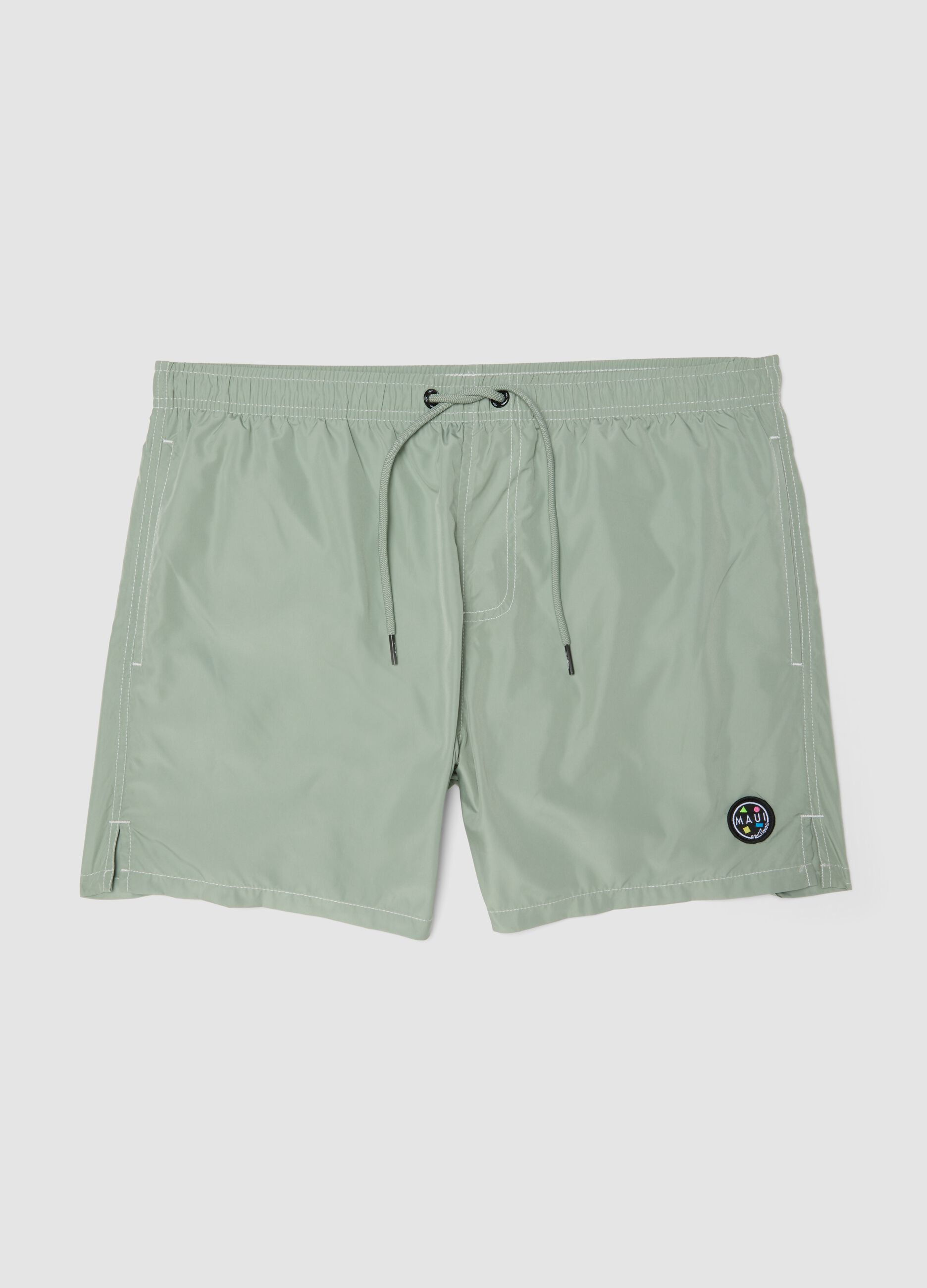 Green swim shorts with elasticated waistband and drawstring