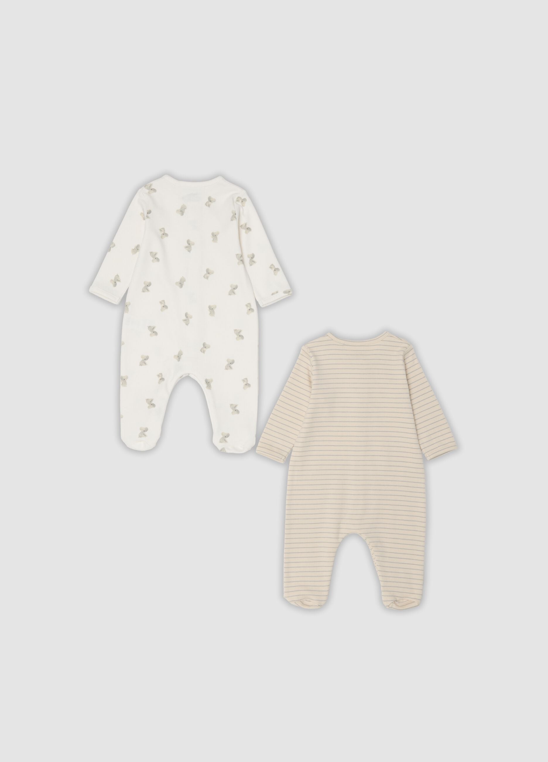 2-pack of organic cotton baby sleepsuits with feet in beige and white