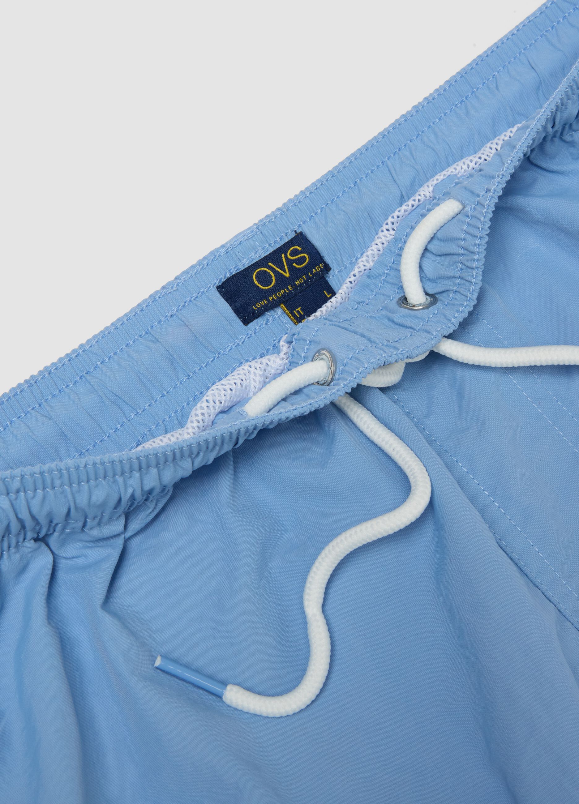 Blue swim shorts with elasticated waist