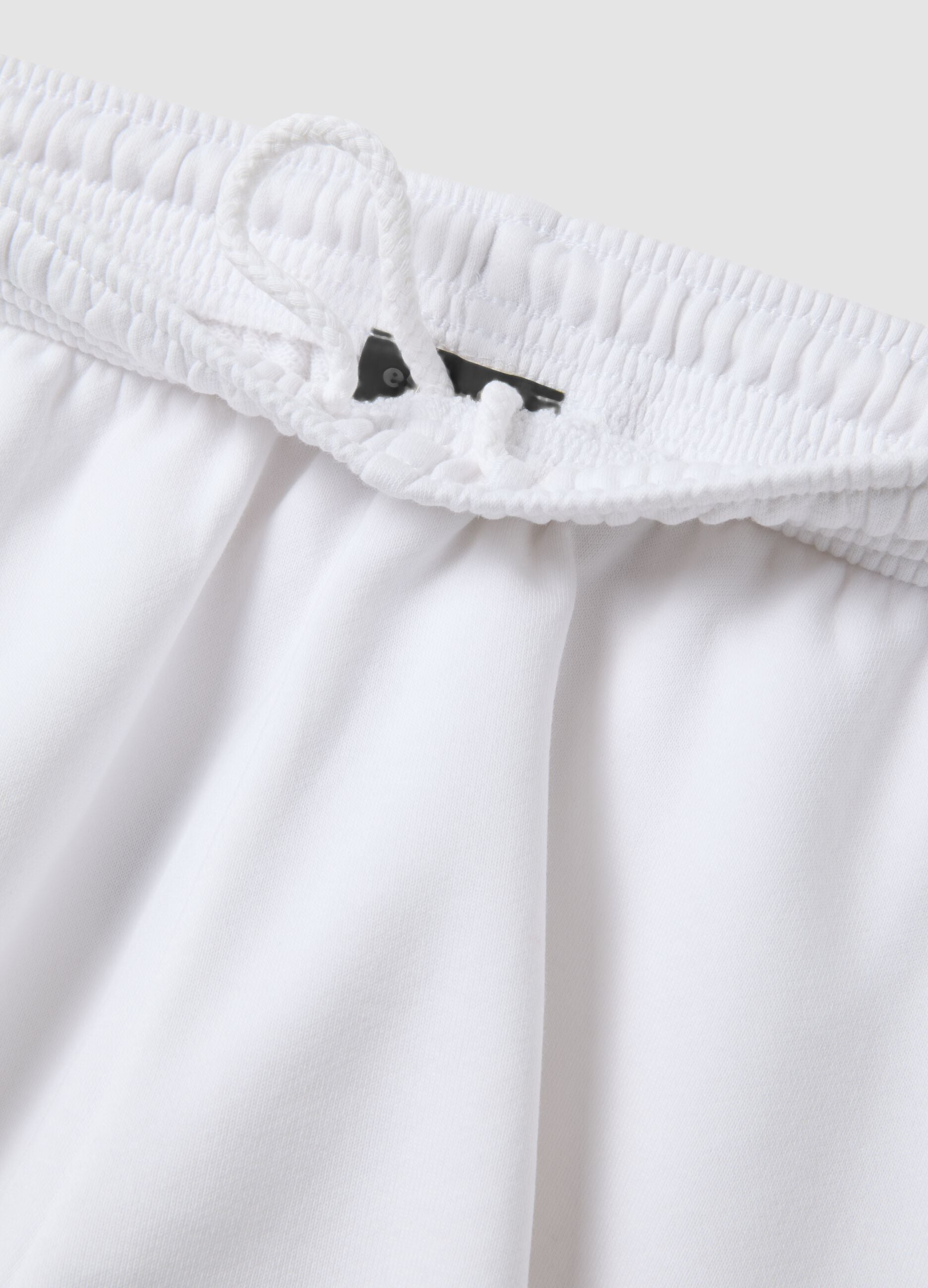 White cotton-blend Bermuda shorts with elasticated waistband