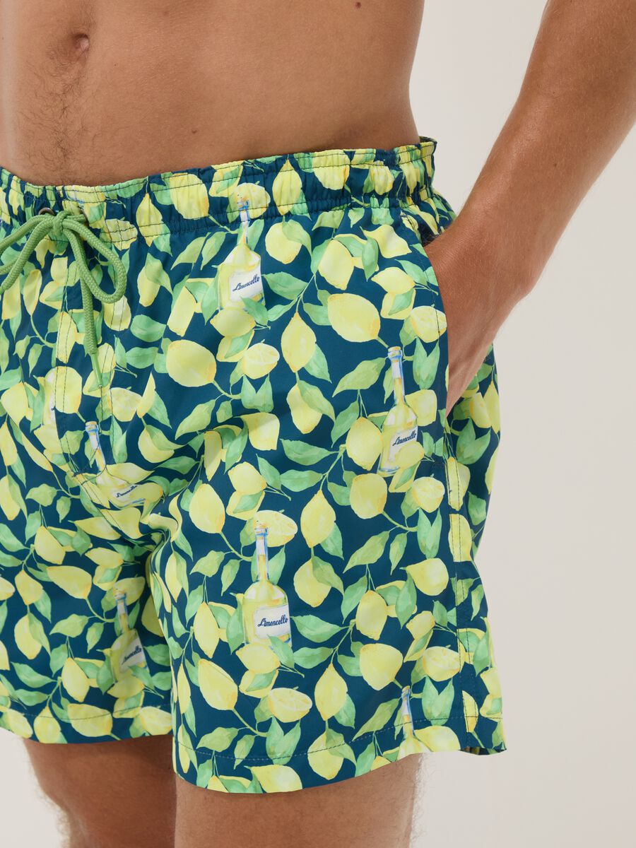 Blue boxer swim shorts with Limoncello print_3
