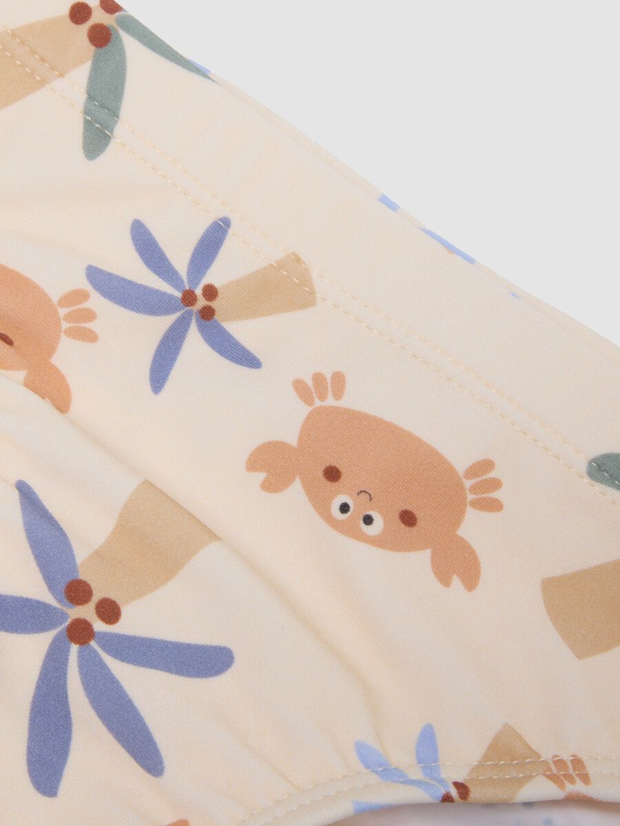 Beige baby swim briefs with prints_2