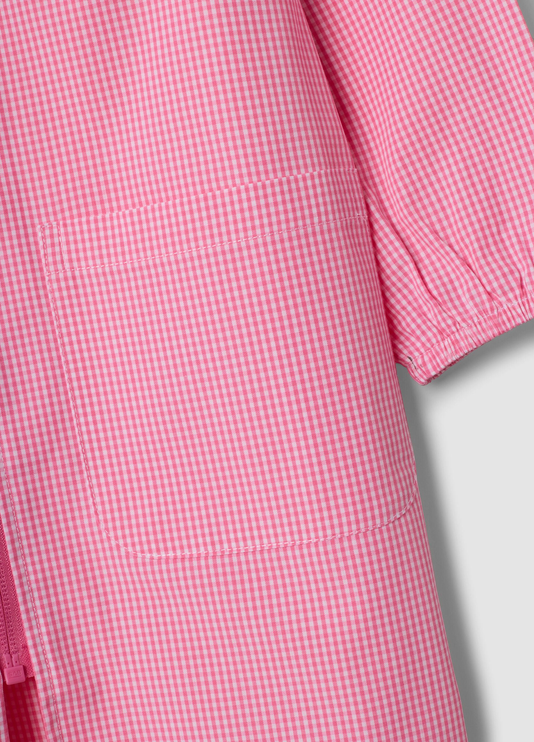 Pink gingham nursery apron with zip, white collar and Frozen embroidery
