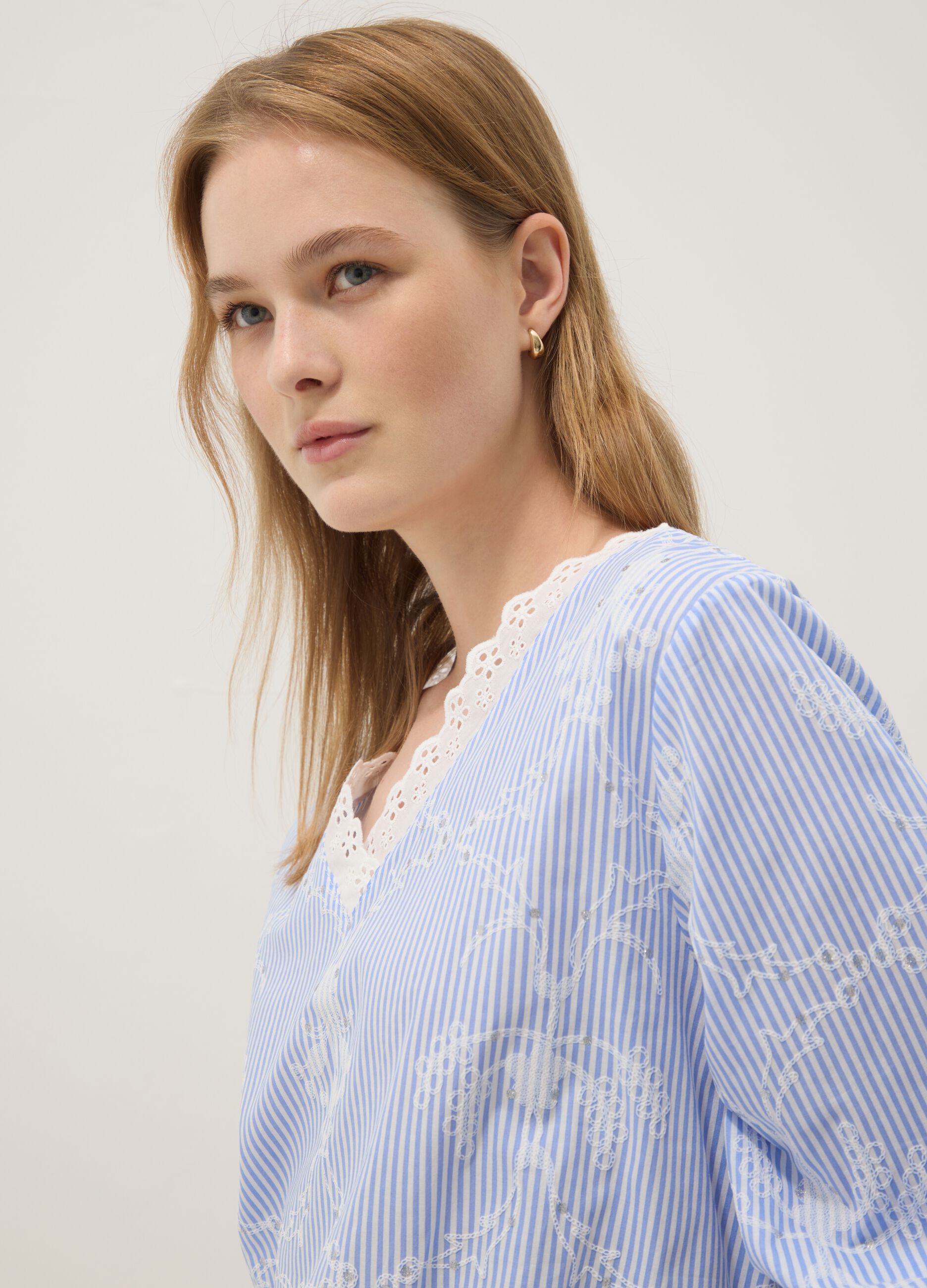 Blue cotton-blend top with embroidery and V-neck