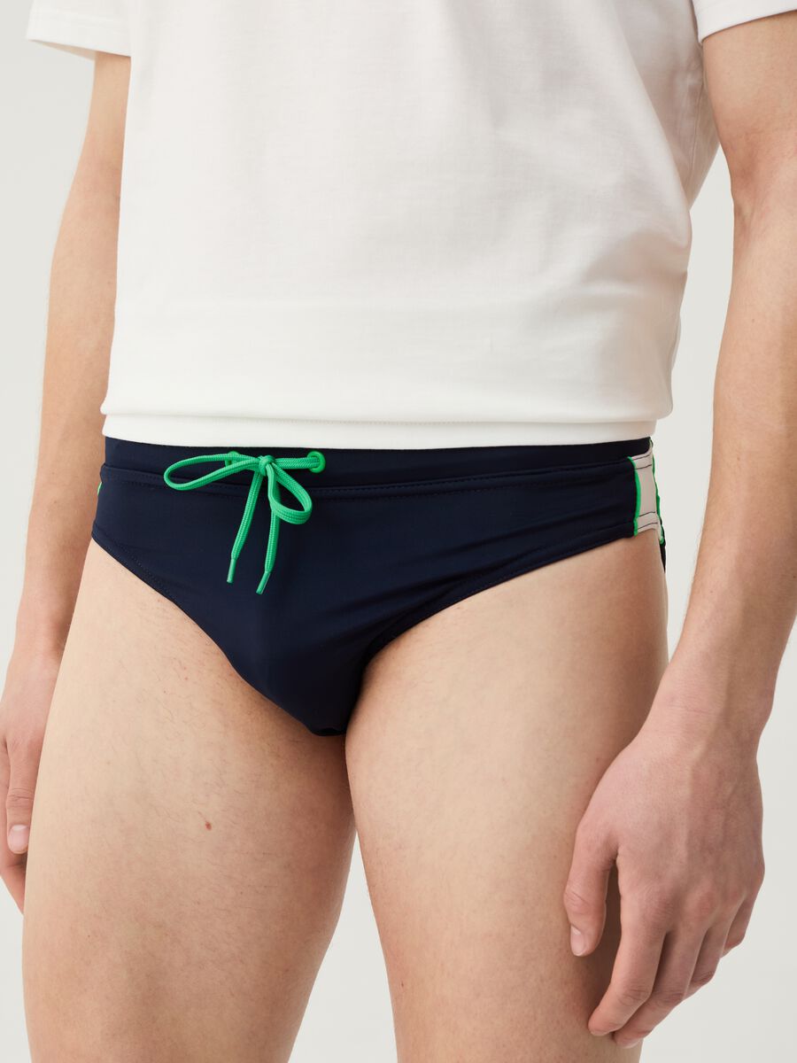 Swim briefs with side bands_1
