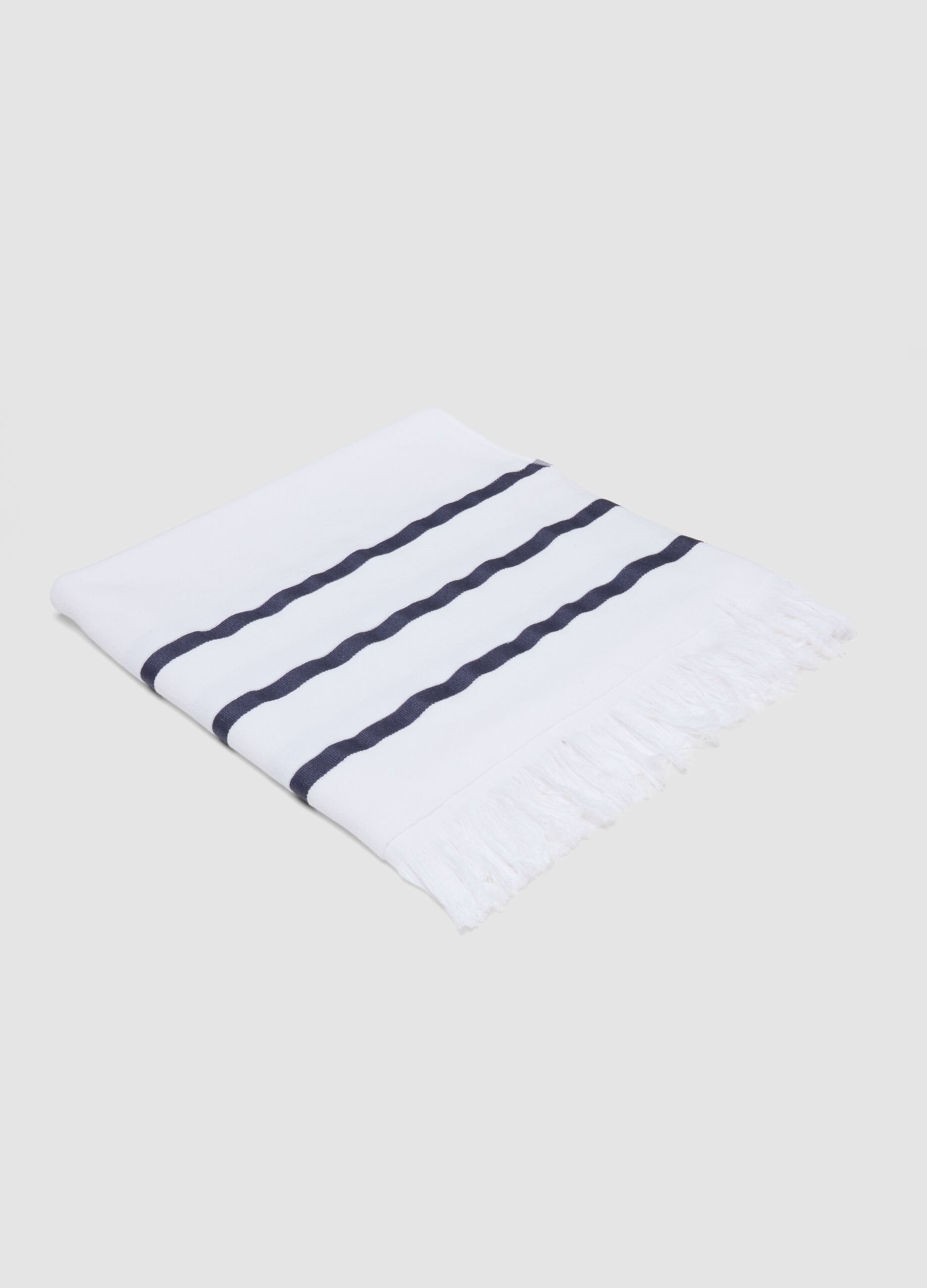 White cotton-blend beach towel with blue stripes