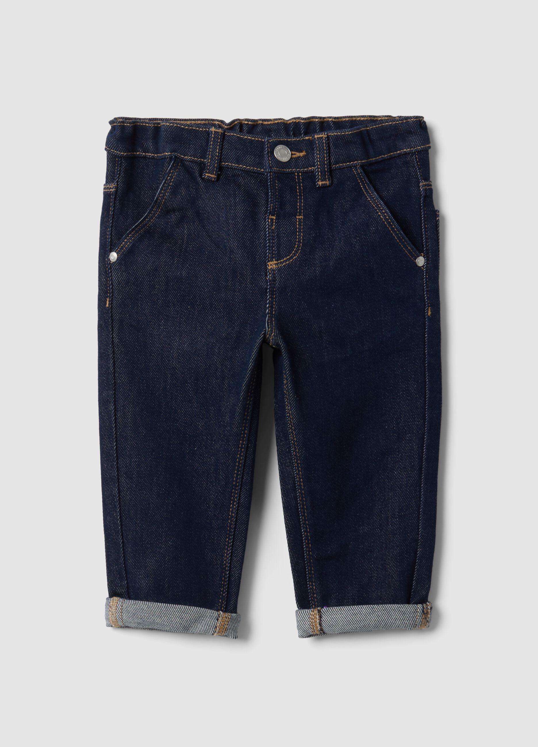 Jeans denim blu scuro in cotone elasticizzato con risvolto per bimbo
