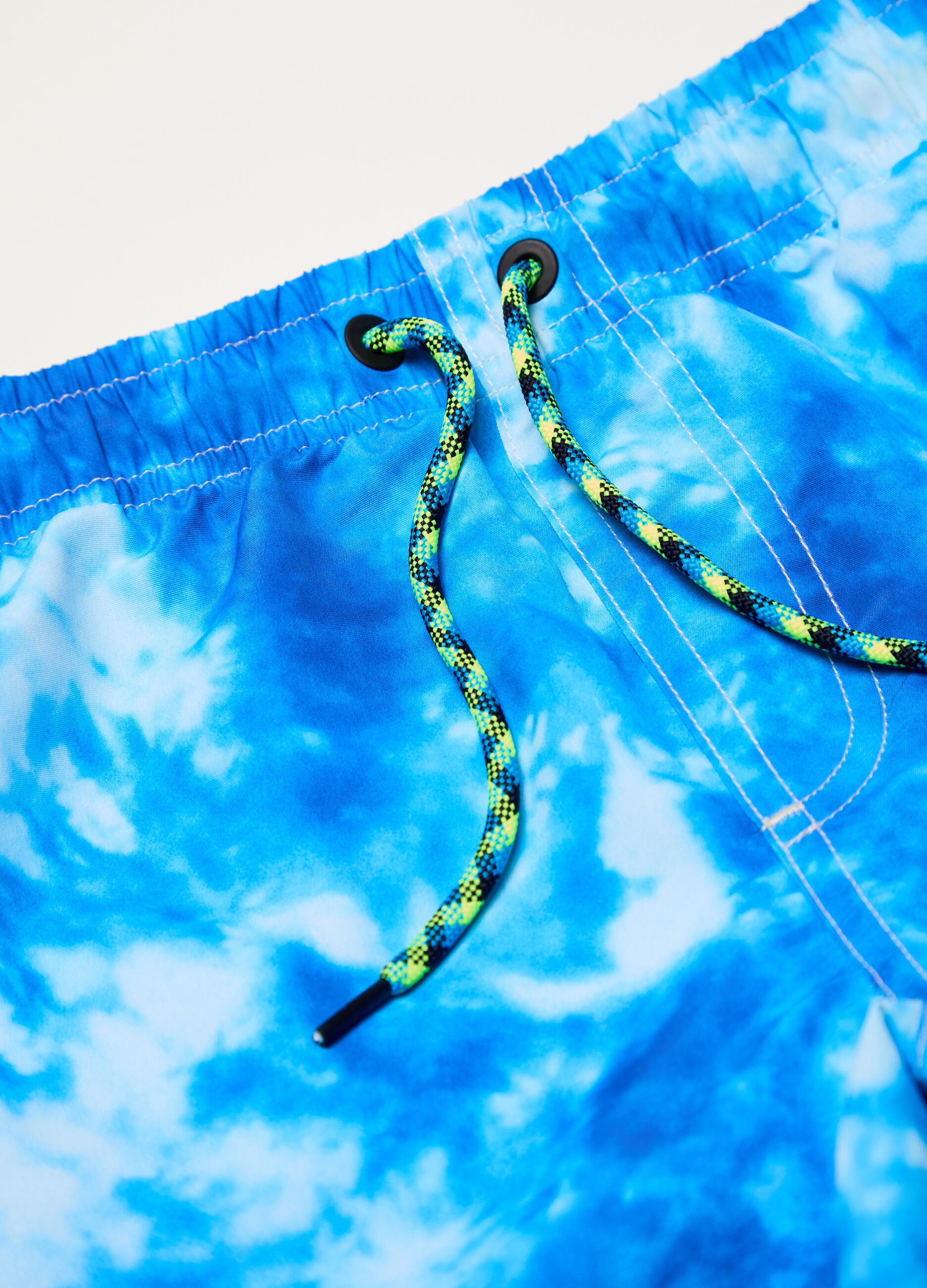 Swimming trunks with tie-dye pattern