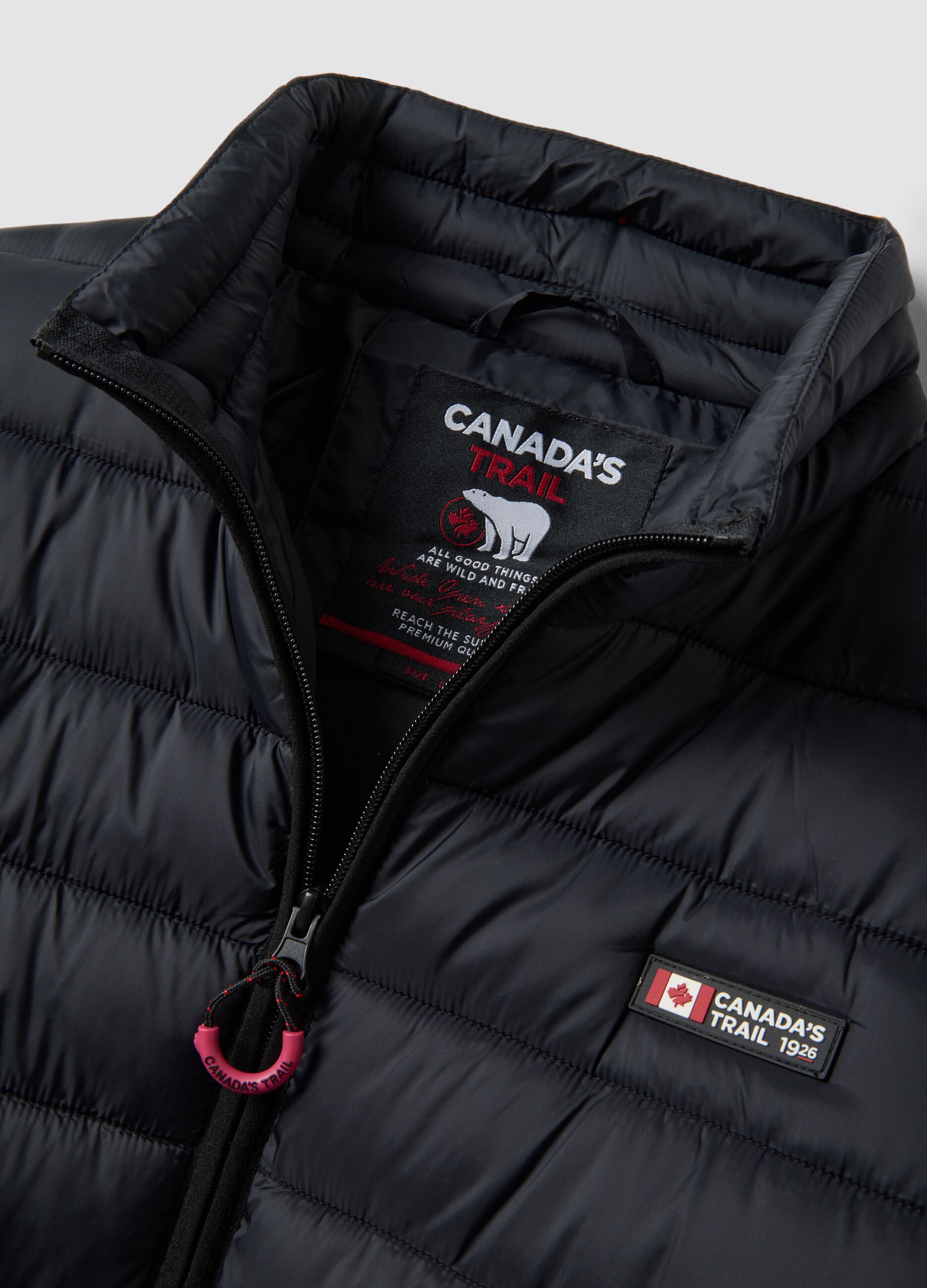 Black padded jacket with high neck and zip