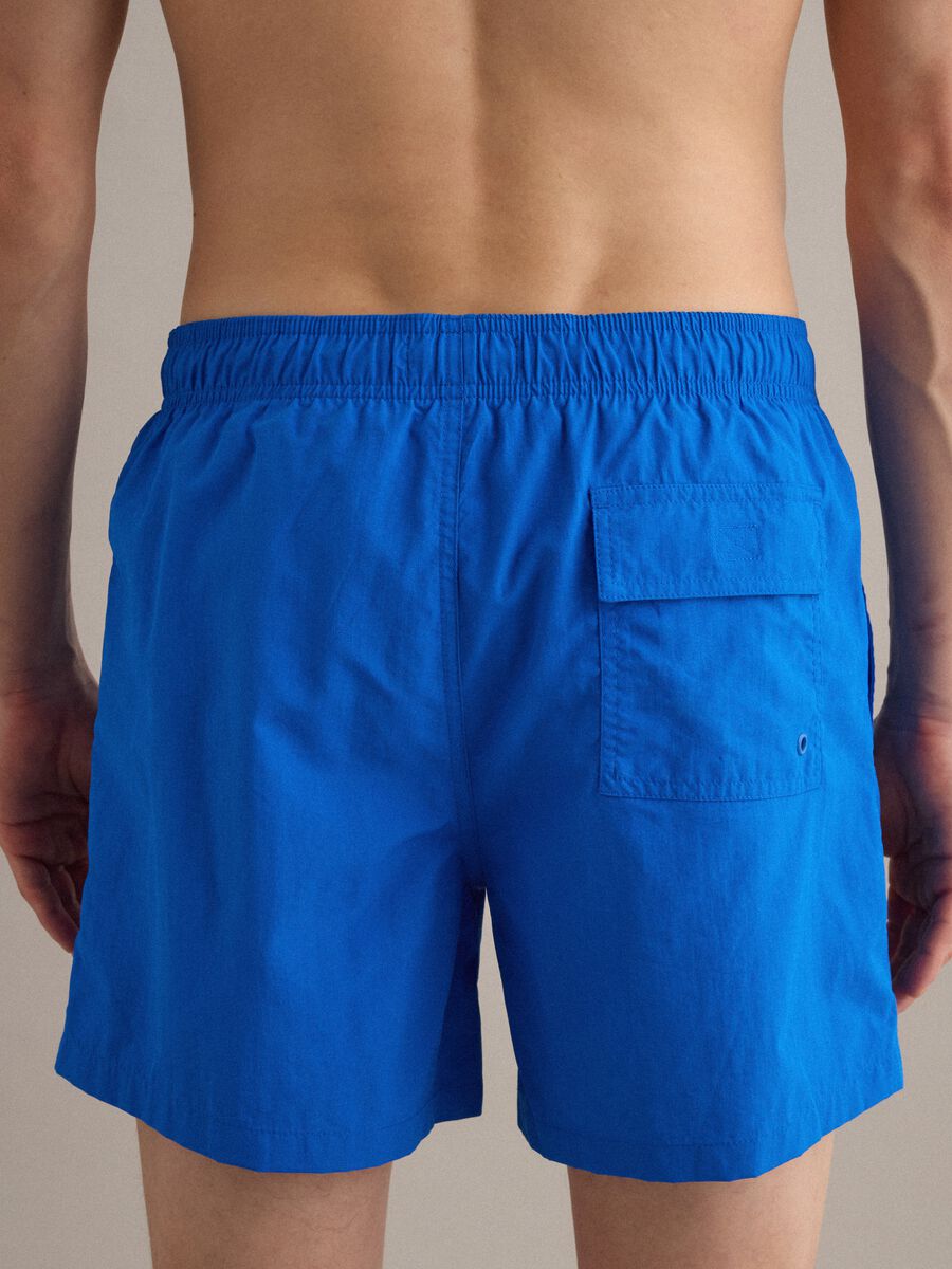 Blue swim shorts with elasticated waist and drawstring_4