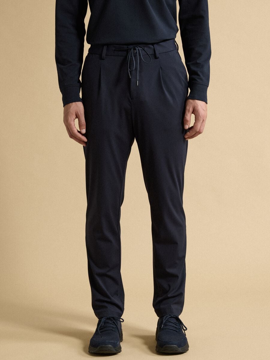 Blue 4-way stretch regular-fit trousers with Easy Iron finish_1