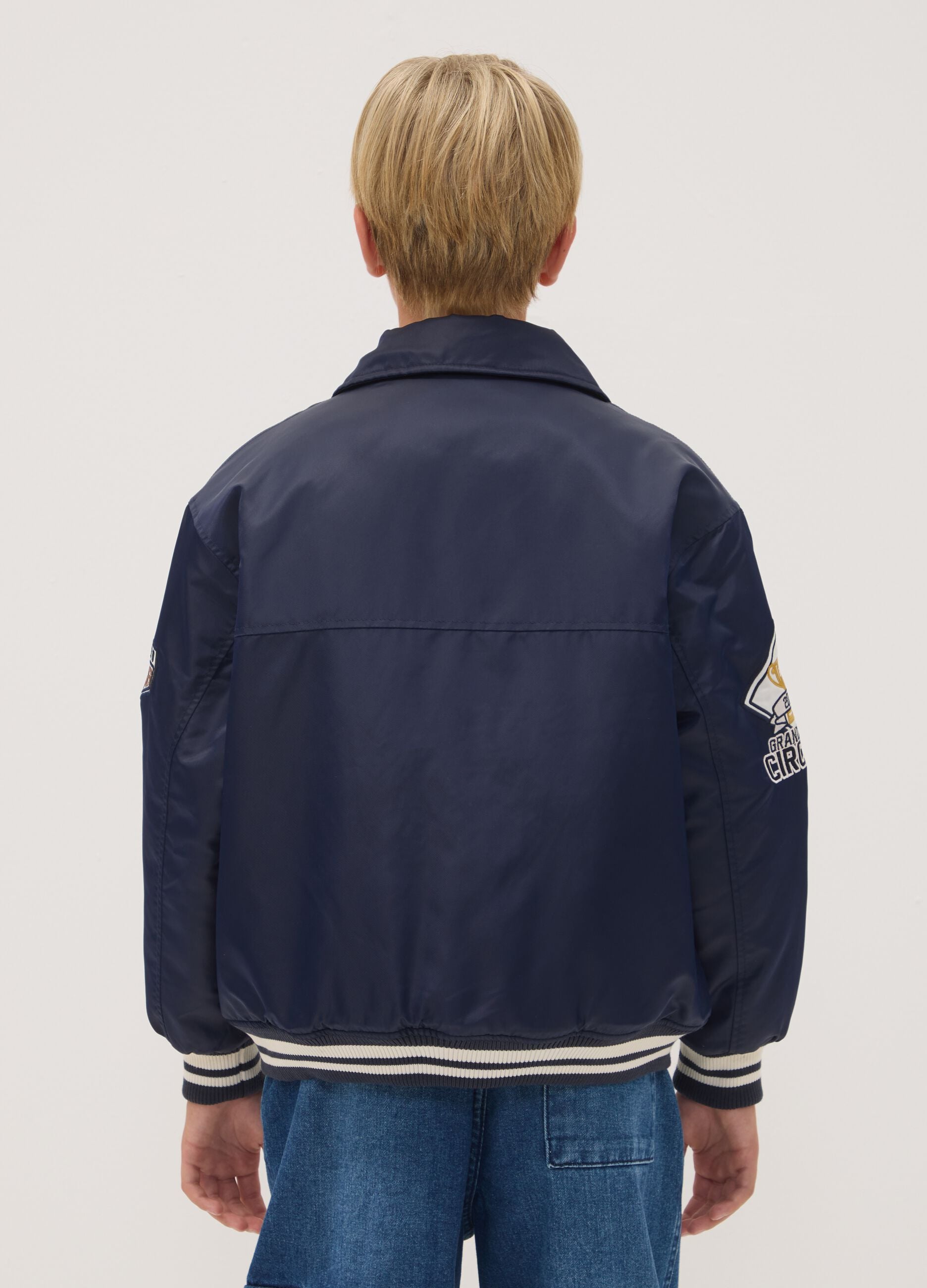 Blue varsity jacket with zip and racing print