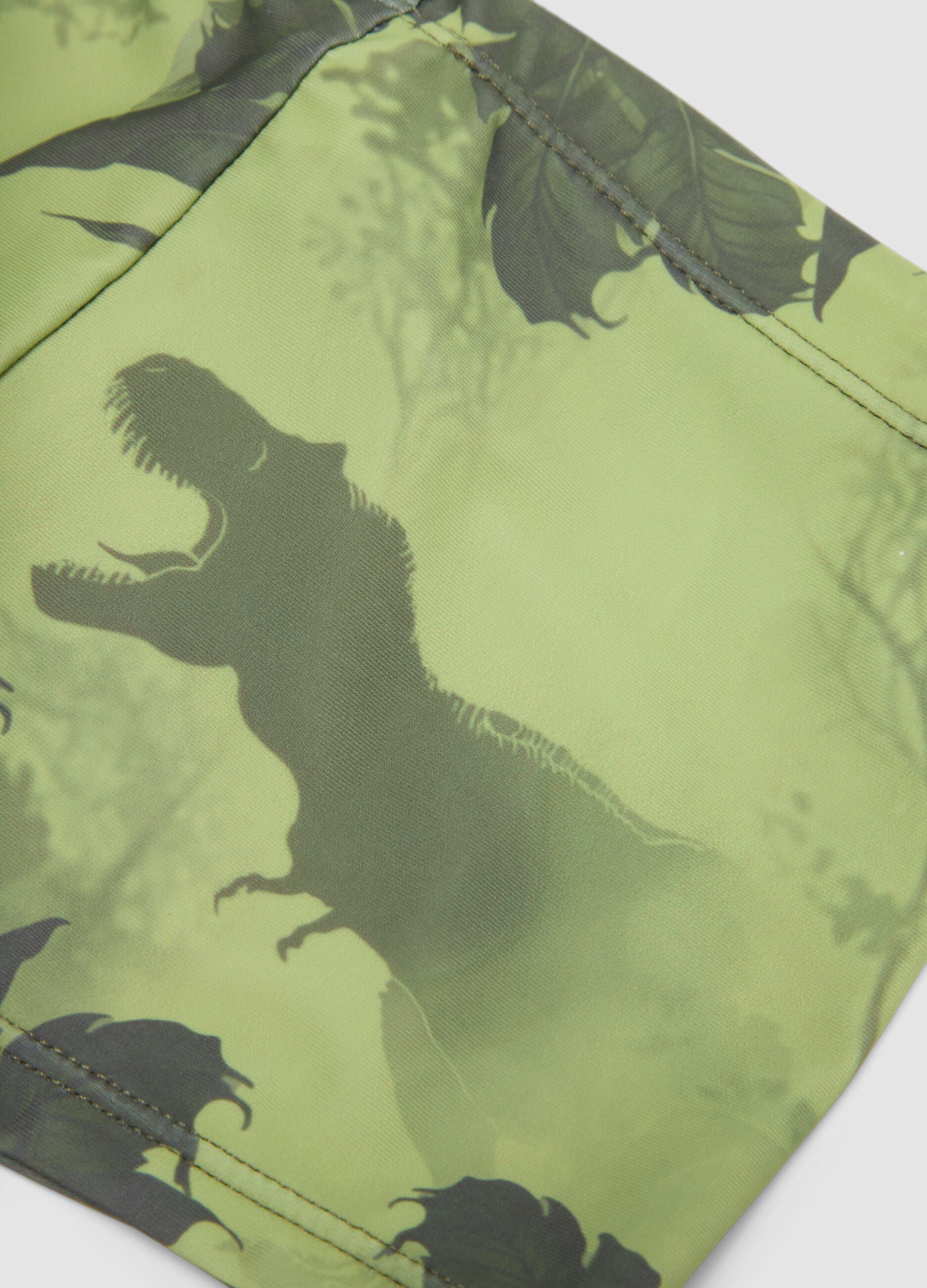 Gr&uuml;ne Stretch-Badehose mit Dino-Print