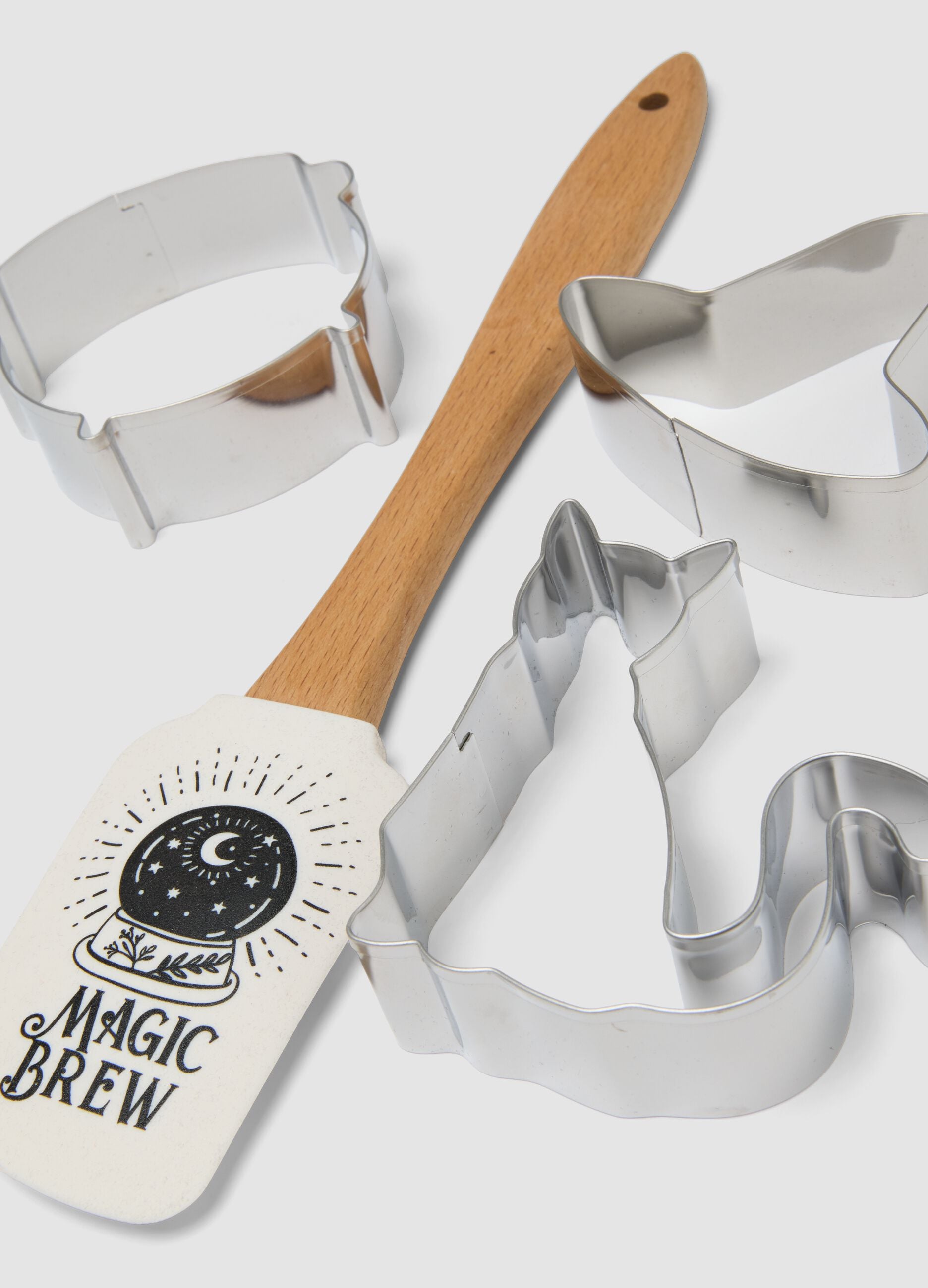 White kitchen set with spatula and cutters