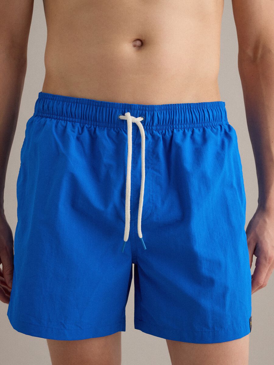 Blue swim shorts with elasticated waist and drawstring_2
