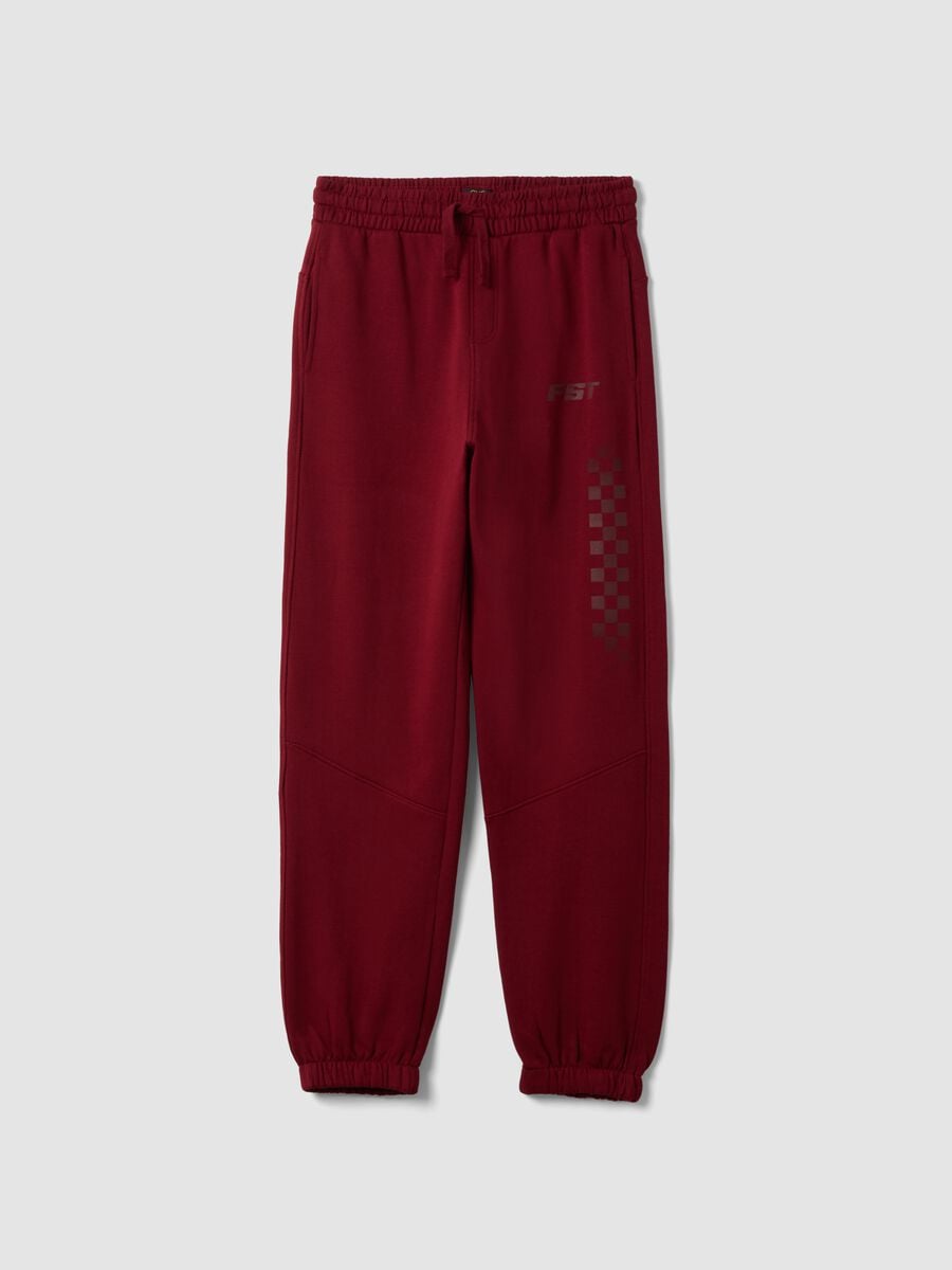 Red relaxed-fit joggers in pure organic cotton with check print_0