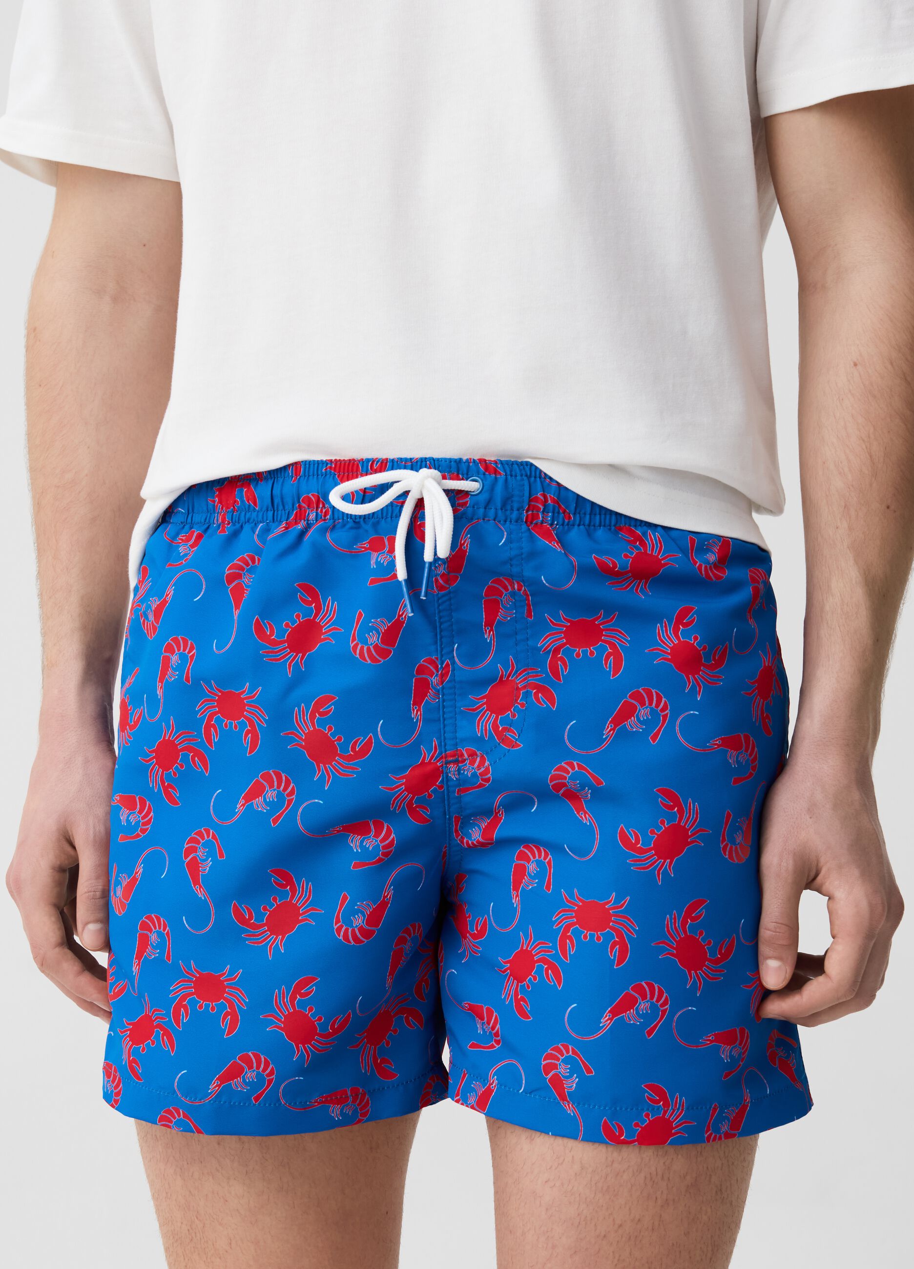 Swimming trunks with crabs print