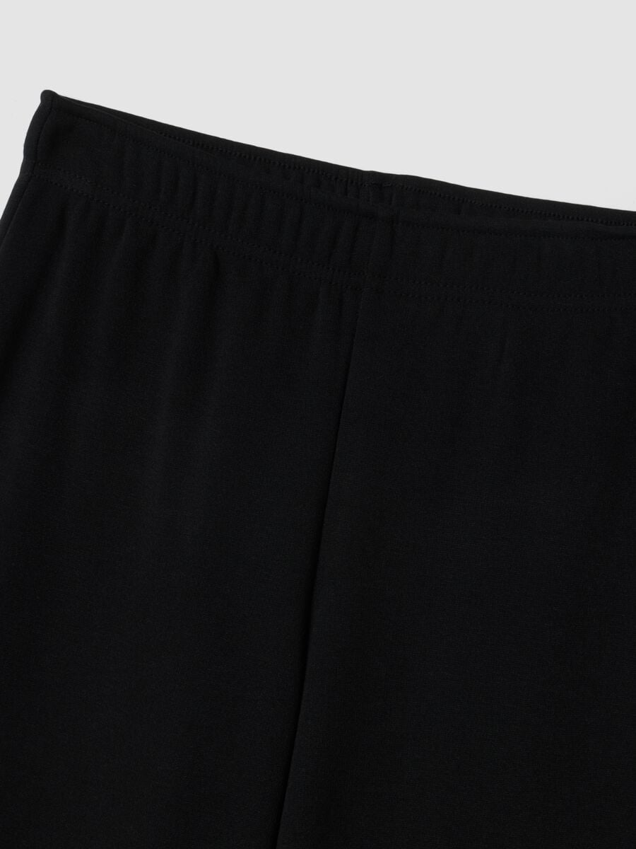 Pantaloni flare neri in viscosa elasticizzata con strass_1