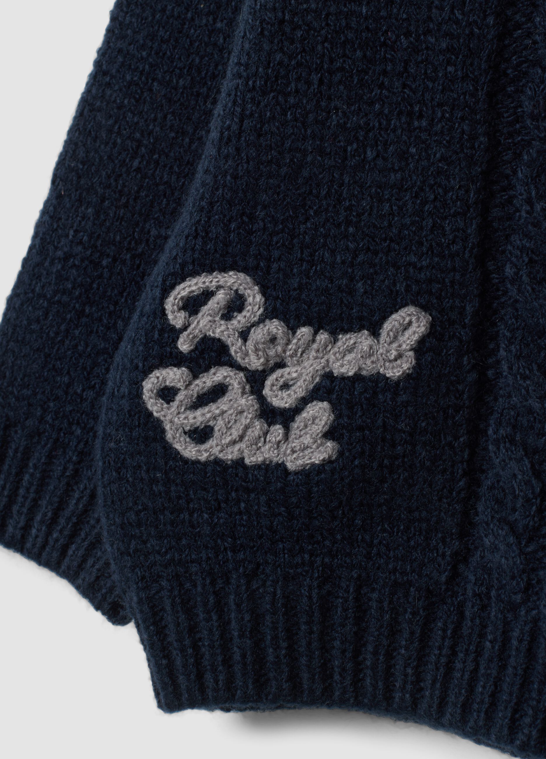 Blue crew-neck cable-knit jumper