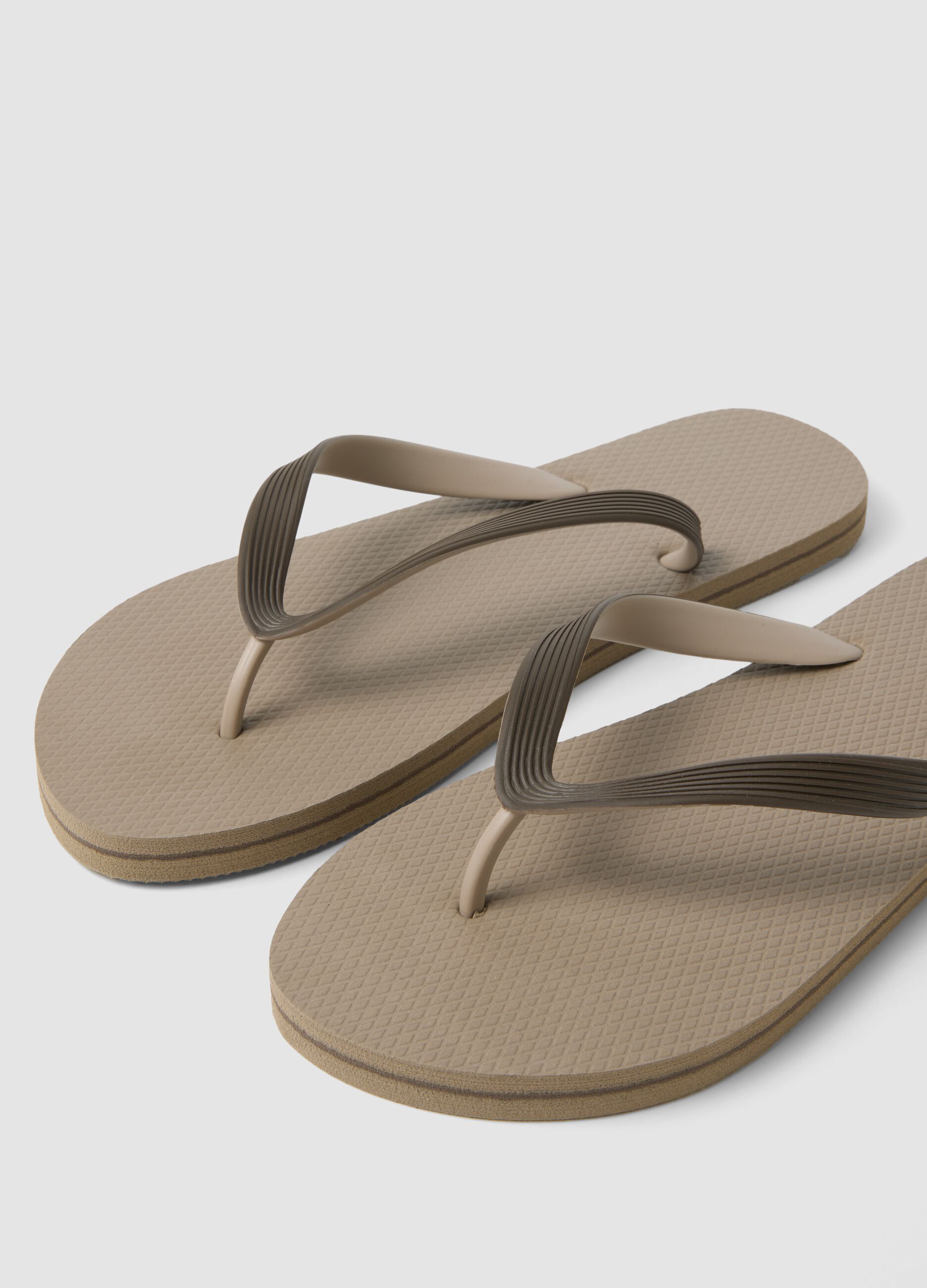 Beige beach flip-flops