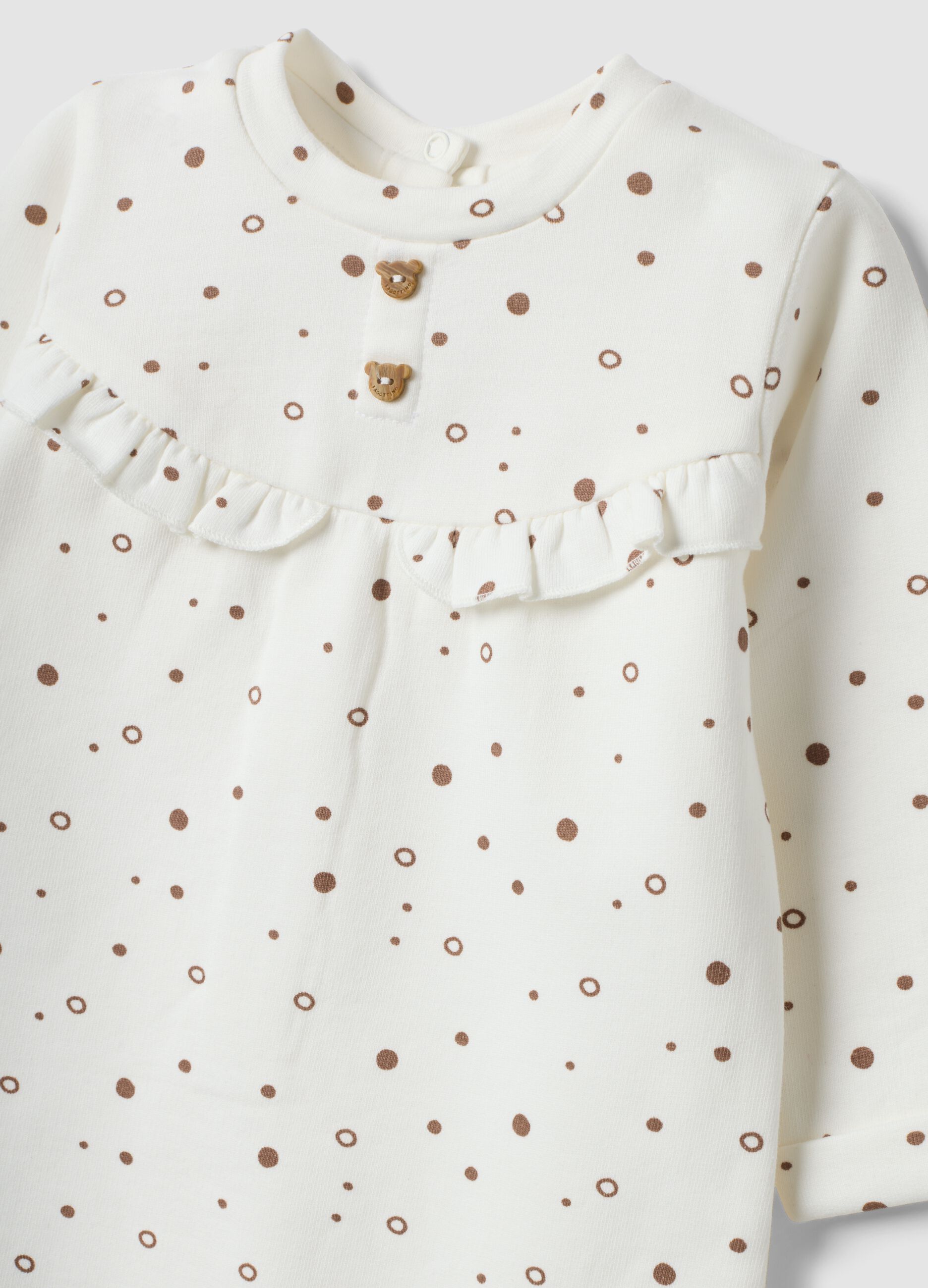 Babygrow branco em algod&atilde;o org&acirc;nico puro &agrave;s bolinhas