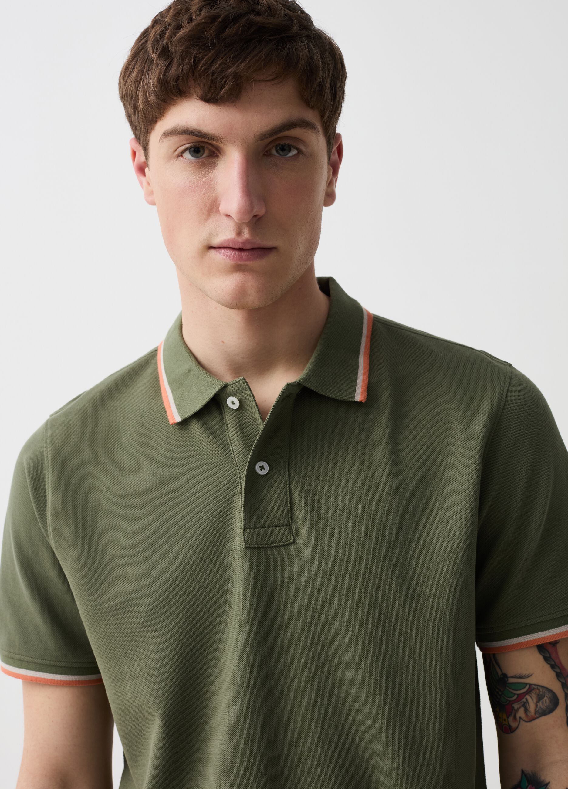 Polo shirt in piquet with striped edging