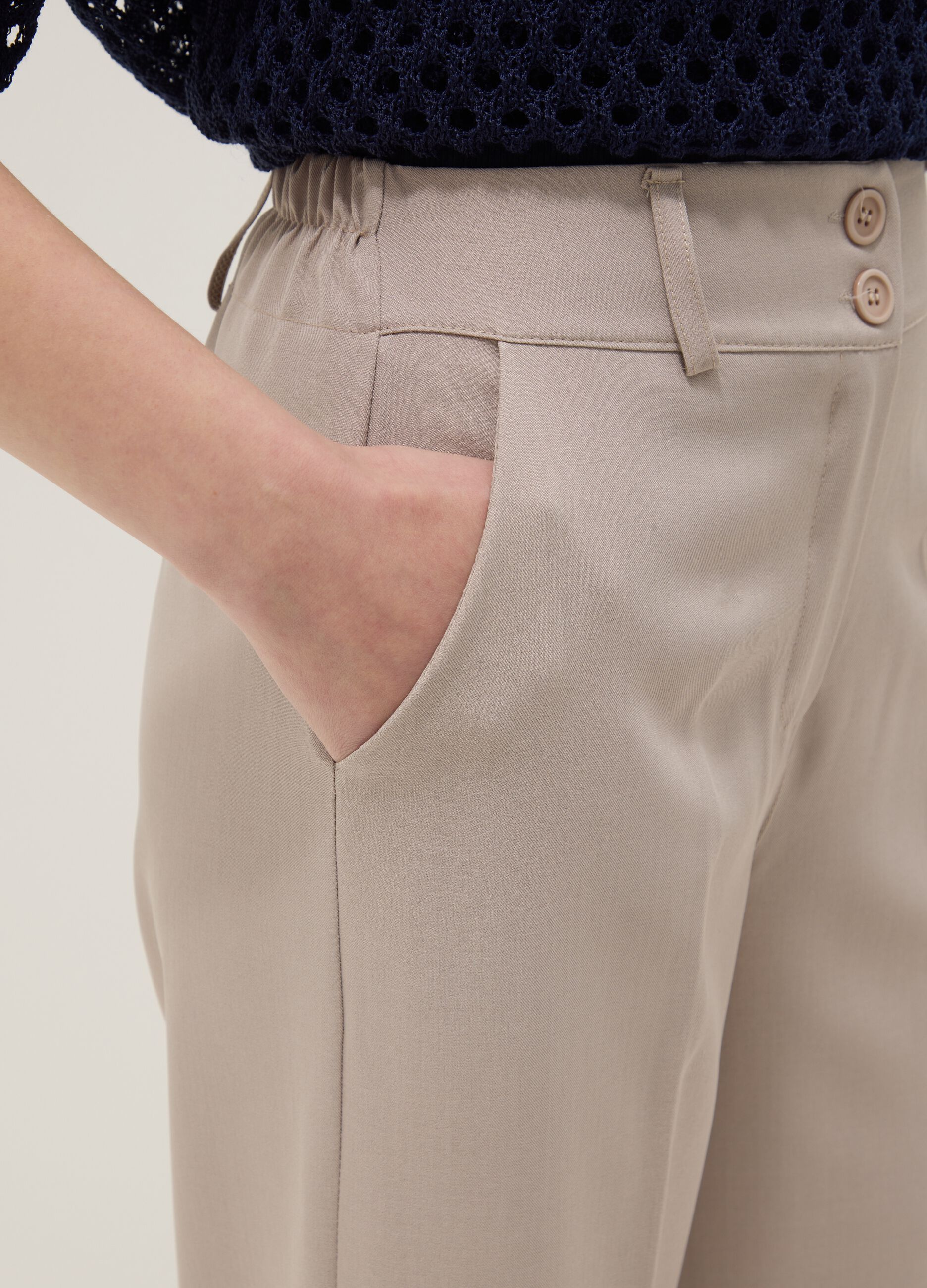 Beige stretch trousers with turn-up hem