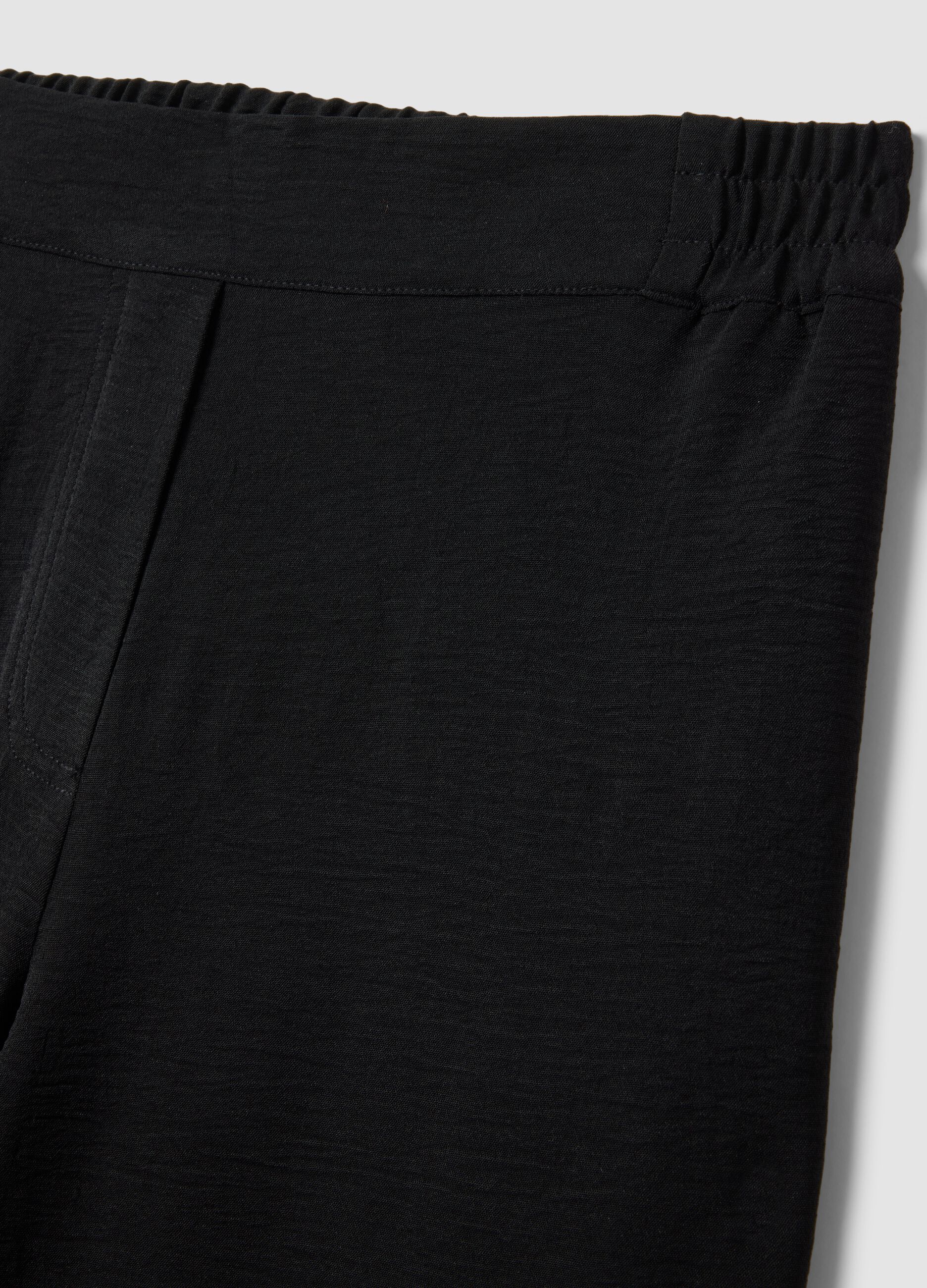 Black wide-leg trousers with elasticated waist