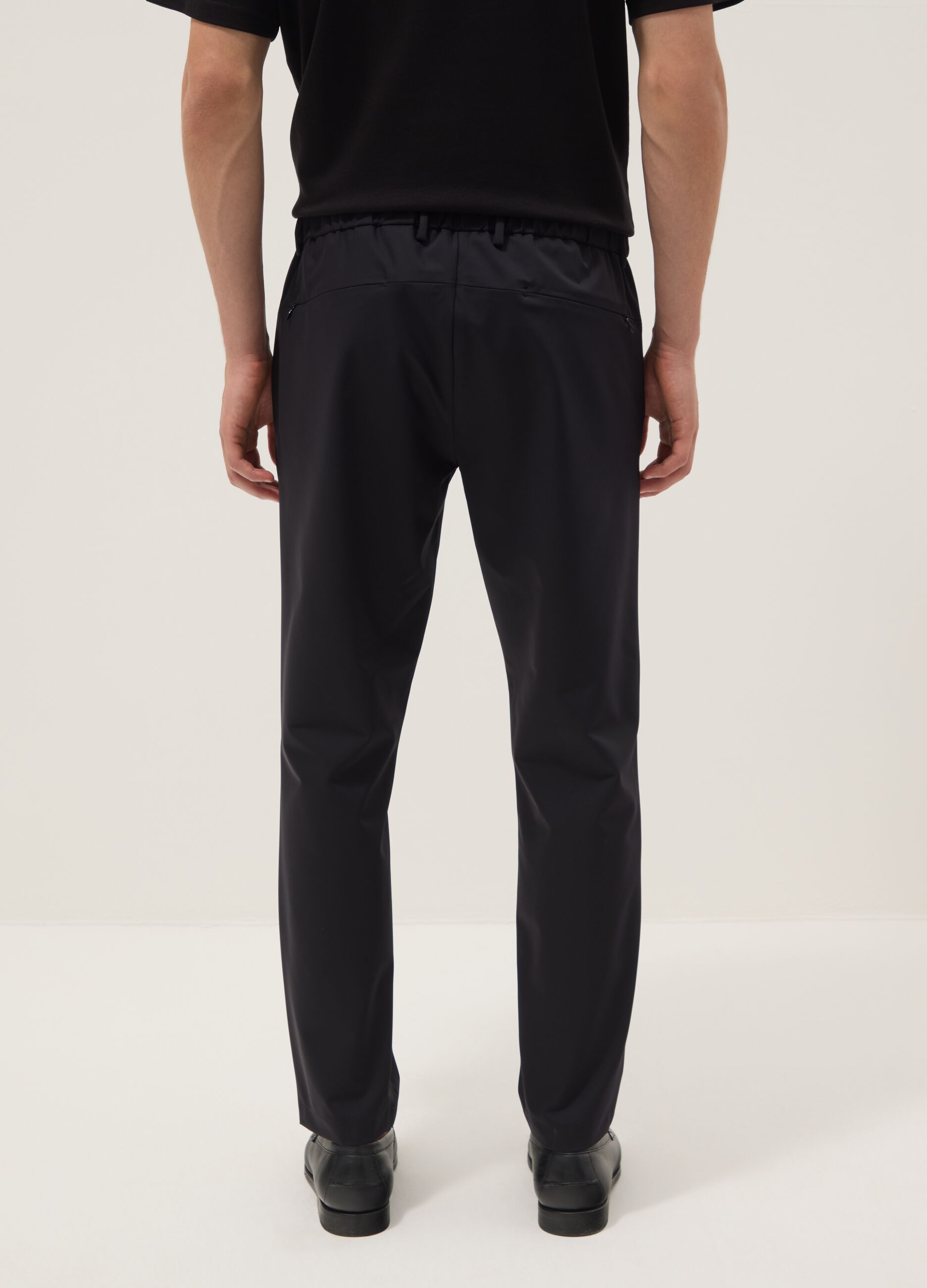 Black stretch carrot-fit chino trousers