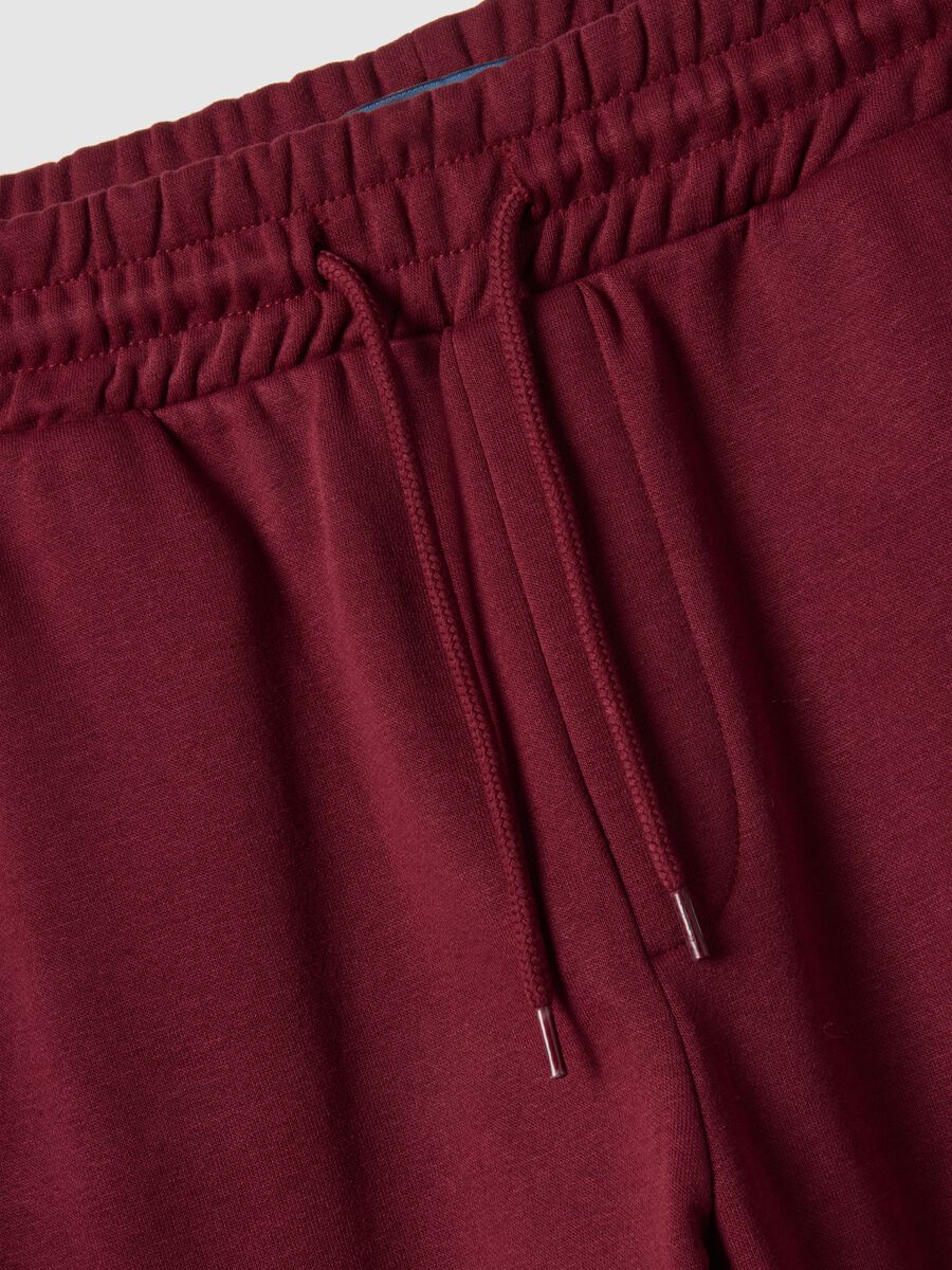 Red regular fit jogger trousers in cotton blend_5
