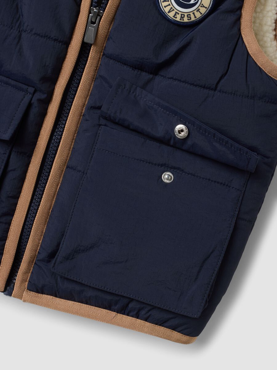Blue padded gilet with zip and contrast trims_2