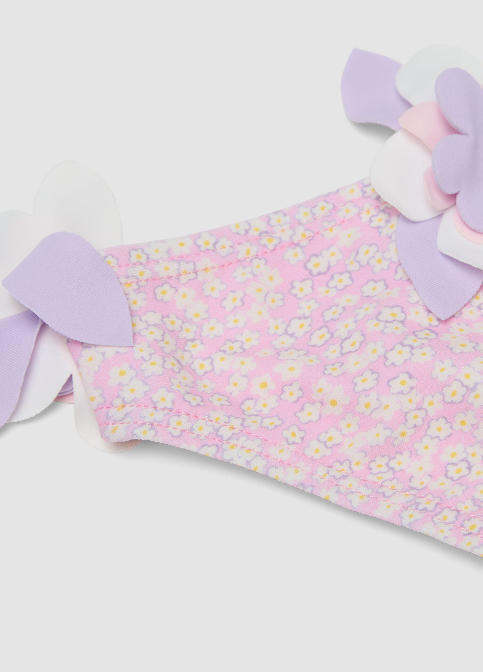 Pink stretch swim briefs with applied floral details