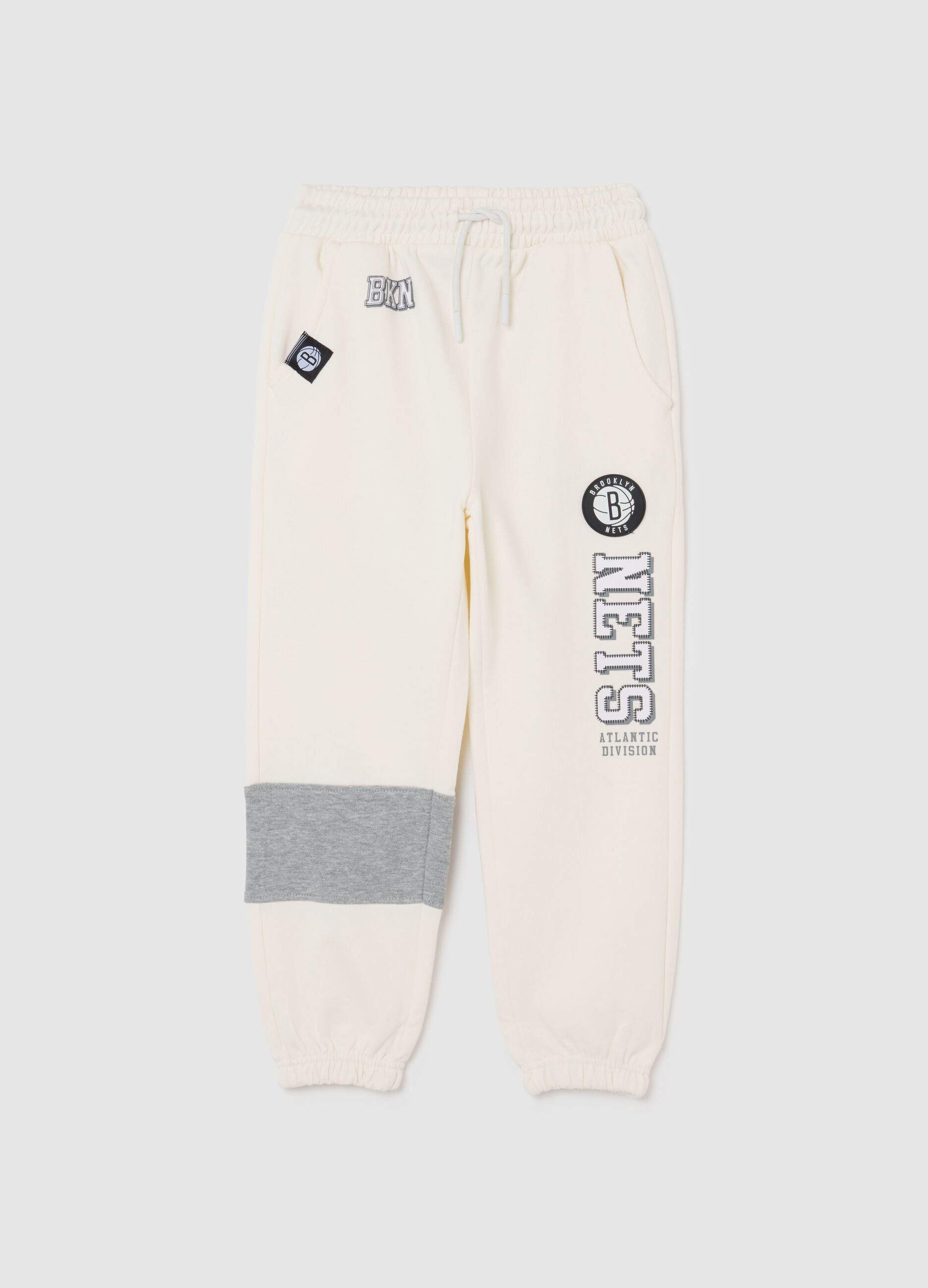 White cotton blend kids' joggers with Nets logo, oversized fit