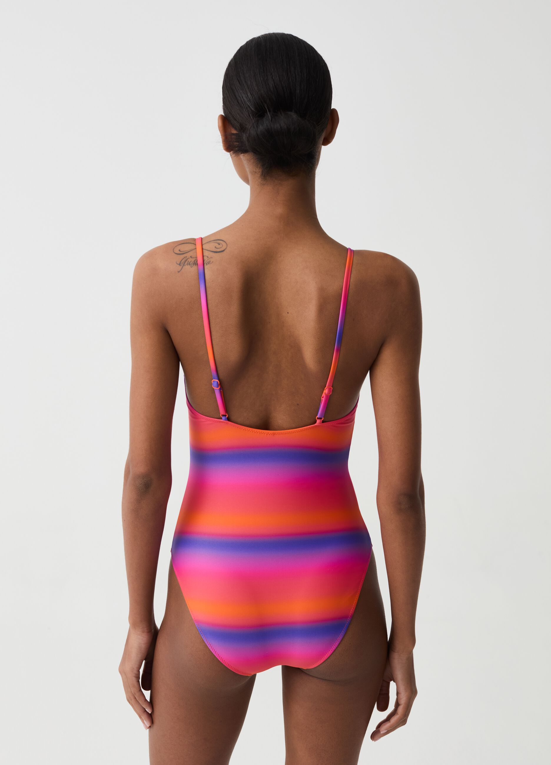 One-piece swimsuit with faded stripe pattern
