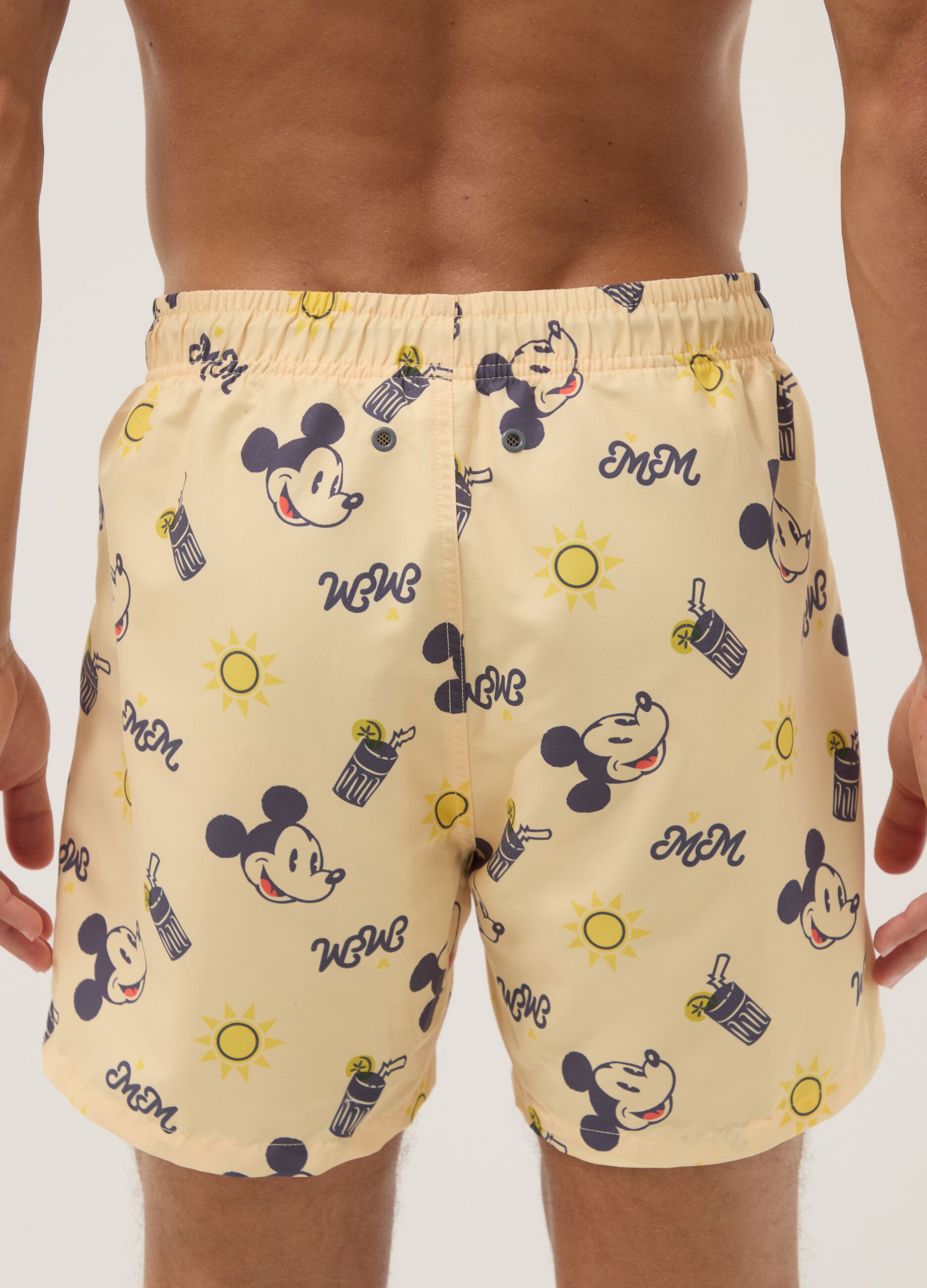 Orange swim trunks with Mickey Mouse prints