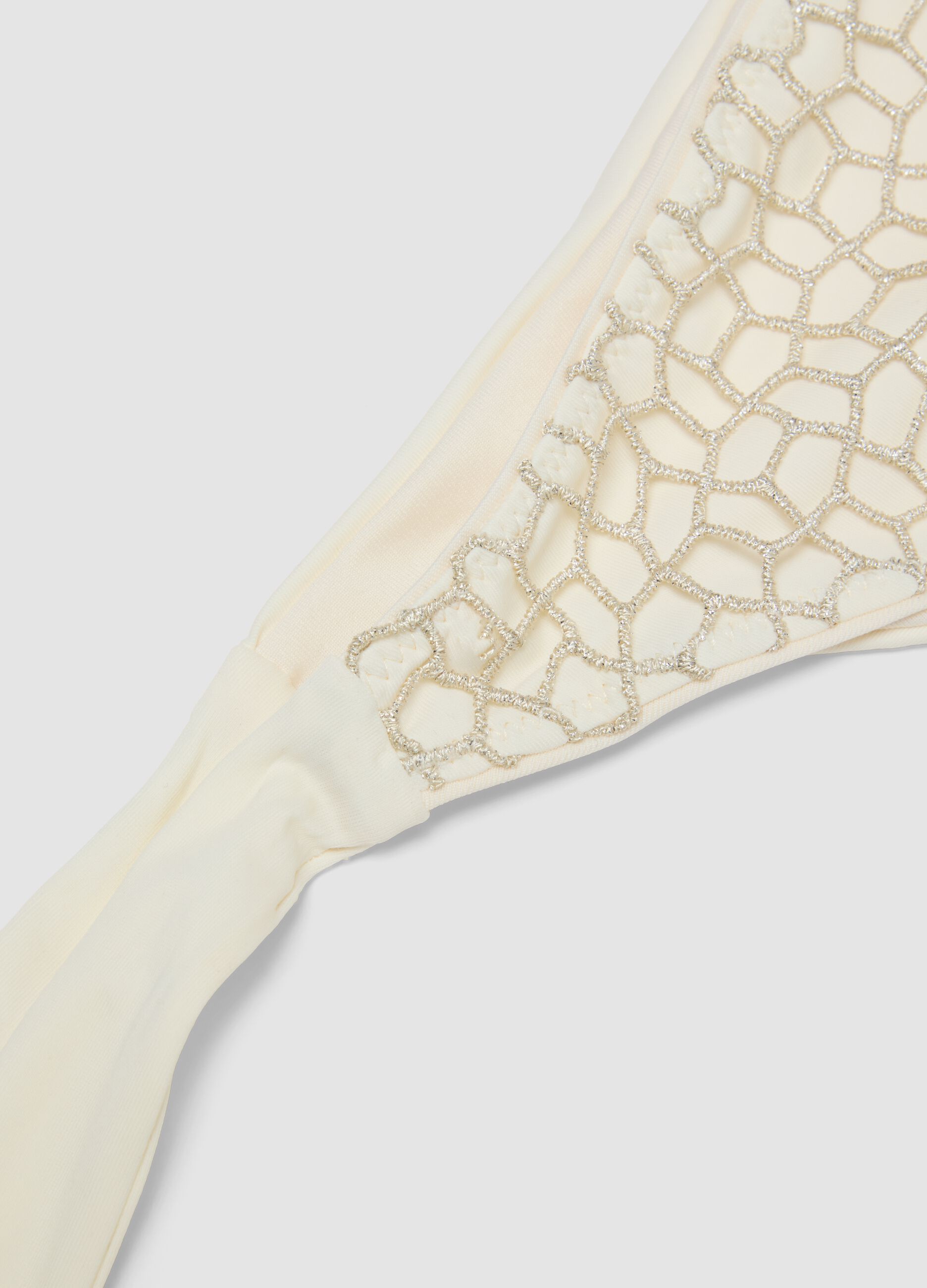 White bikini bottoms with mesh-effect embroidery and tie sides