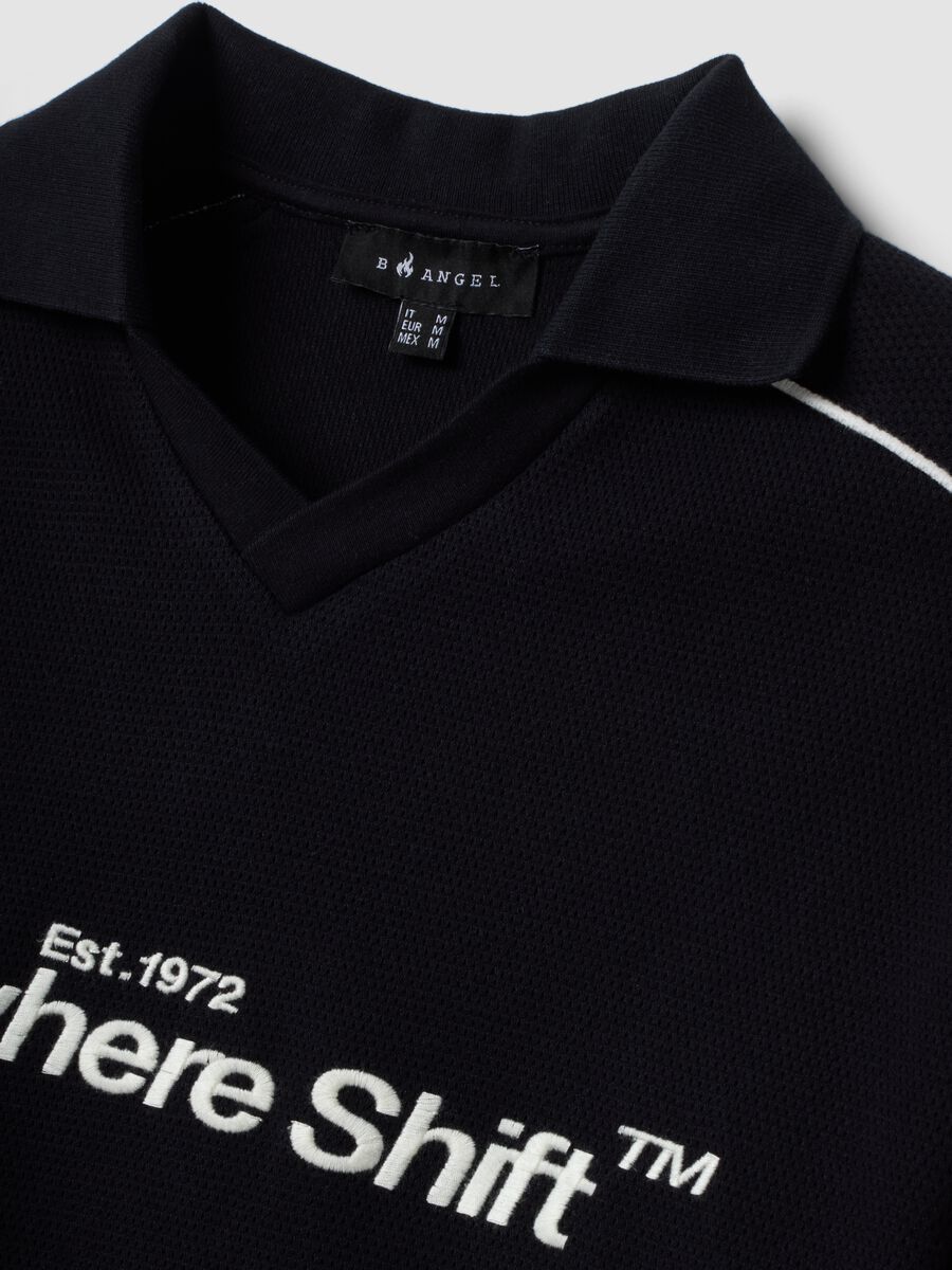 Polo blu in puro cotone over fit a maniche corte_1